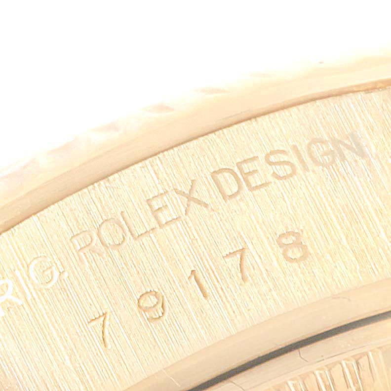 This image shows a close-up of the case back engraving on a Rolex President 79178 Women's Yellow Gold Silver Dial 79178 Women's Yellow Gold Silver Dial model watch.