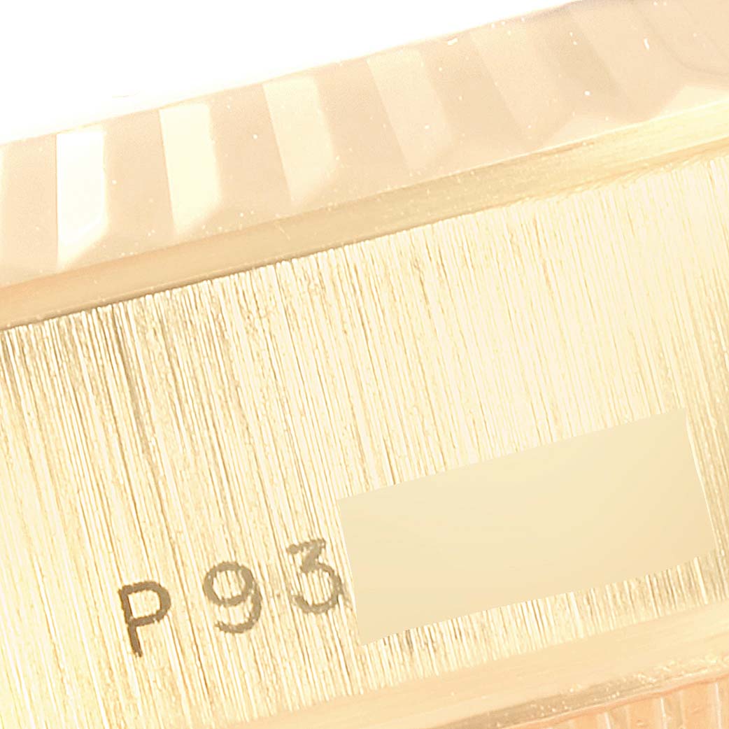 This image shows a close-up of the case side near the bezel with part of the serial number of a Rolex President 79178 Women's Yellow Gold Silver Dial 79178 Women's Yellow Gold Silver Dial model watch.