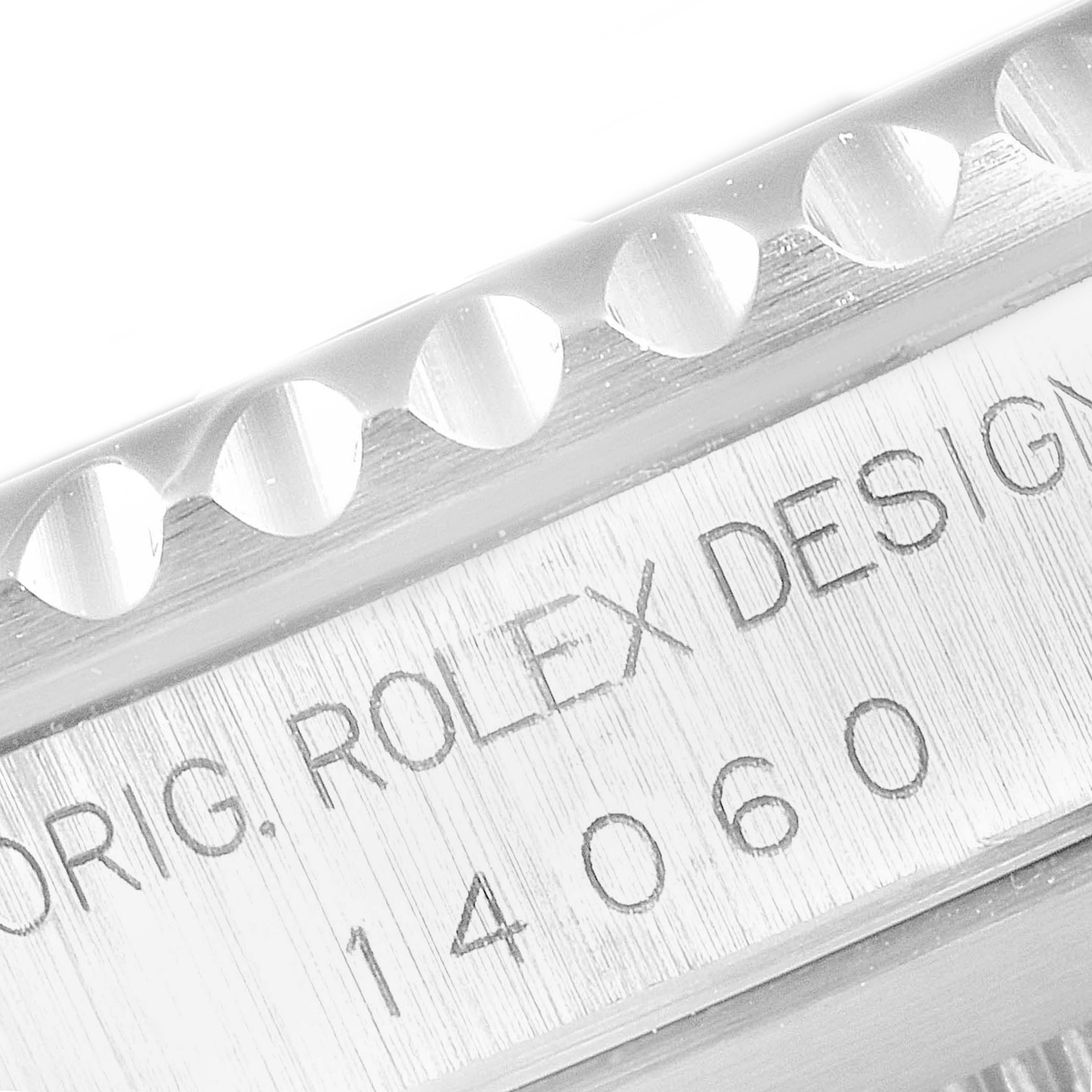 The image shows a close-up of the model and brand engravings on the bezel and side of a Rolex Submariner 14060 Men's Stainless Steel Black Dial 14060 Men's Stainless Steel Black Dial watch, model 14060.