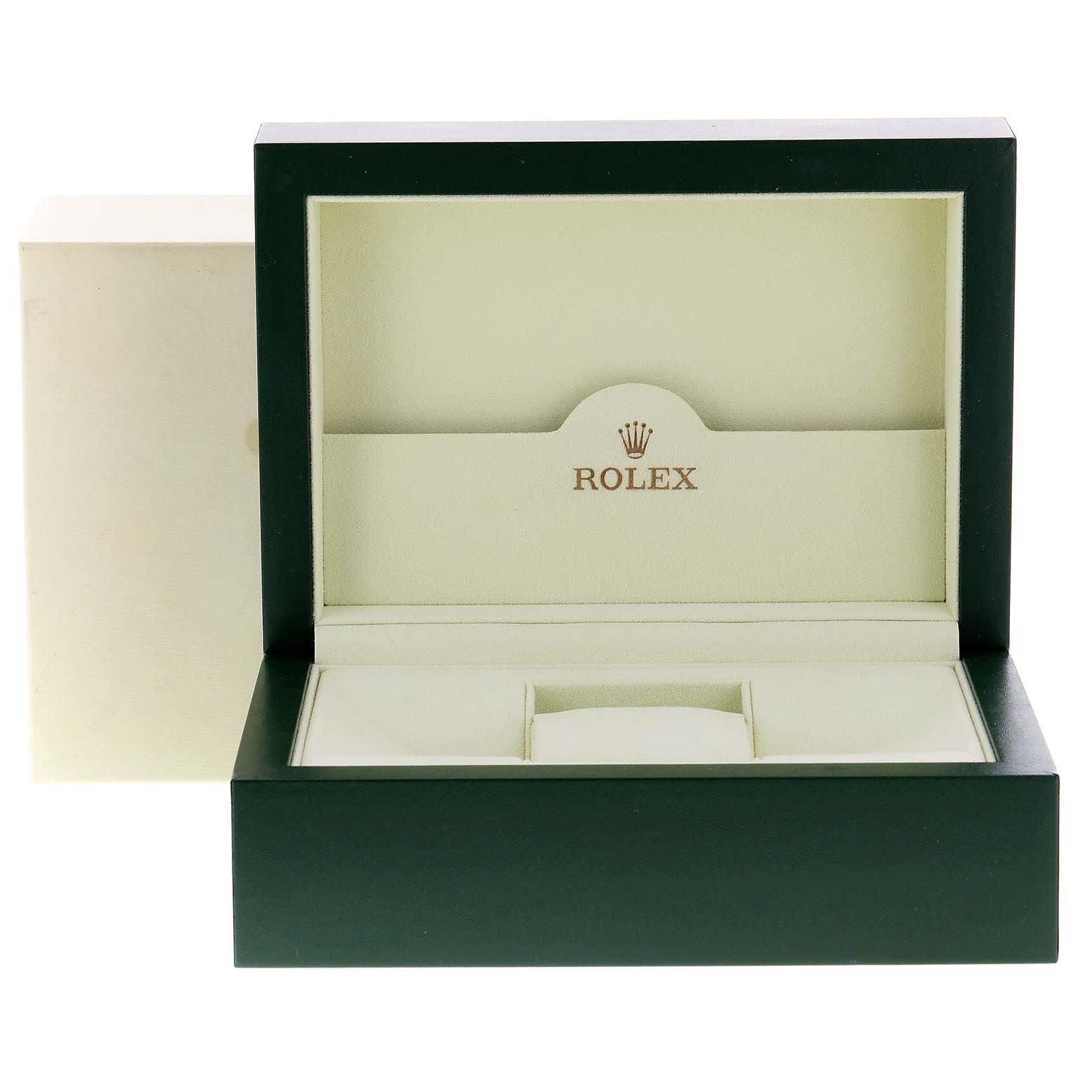This image shows an open Rolex Submariner 16613 Men's Steel and Gold (two tone) Black Dial 16613 Men's Steel and Gold (two tone) Black Dial watch box, showcasing its internal compartments and the Rolex logo.
