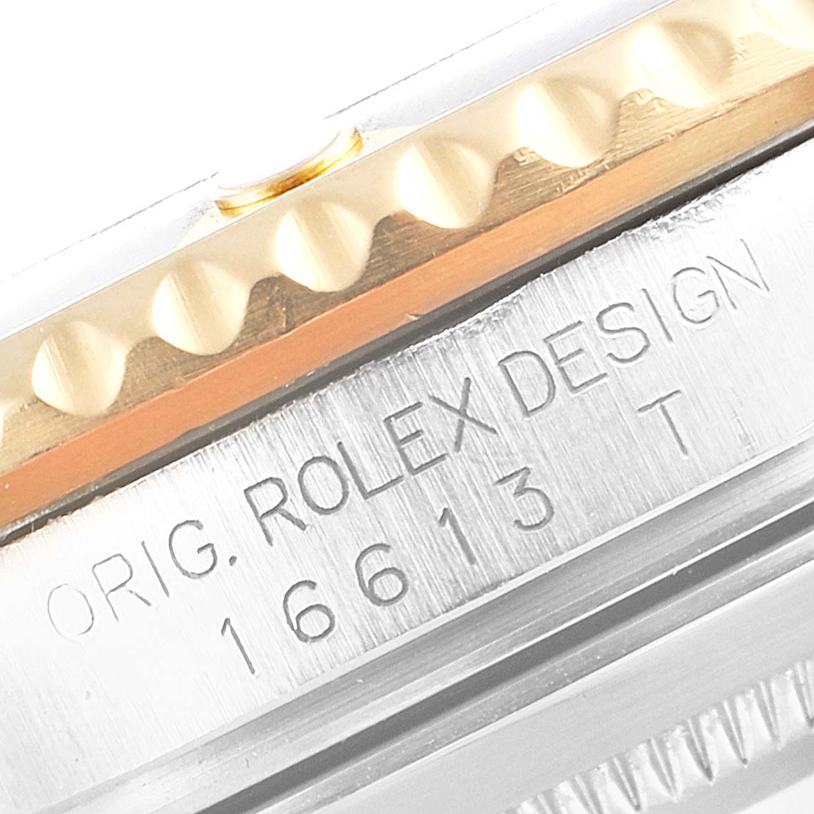 This image shows the side view of a Rolex Submariner 16613 Men's Steel and Gold (two tone) Black Dial 16613 Men's Steel and Gold (two tone) Black Dial watch, highlighting the engraved model number 16613 and part of the bezel.