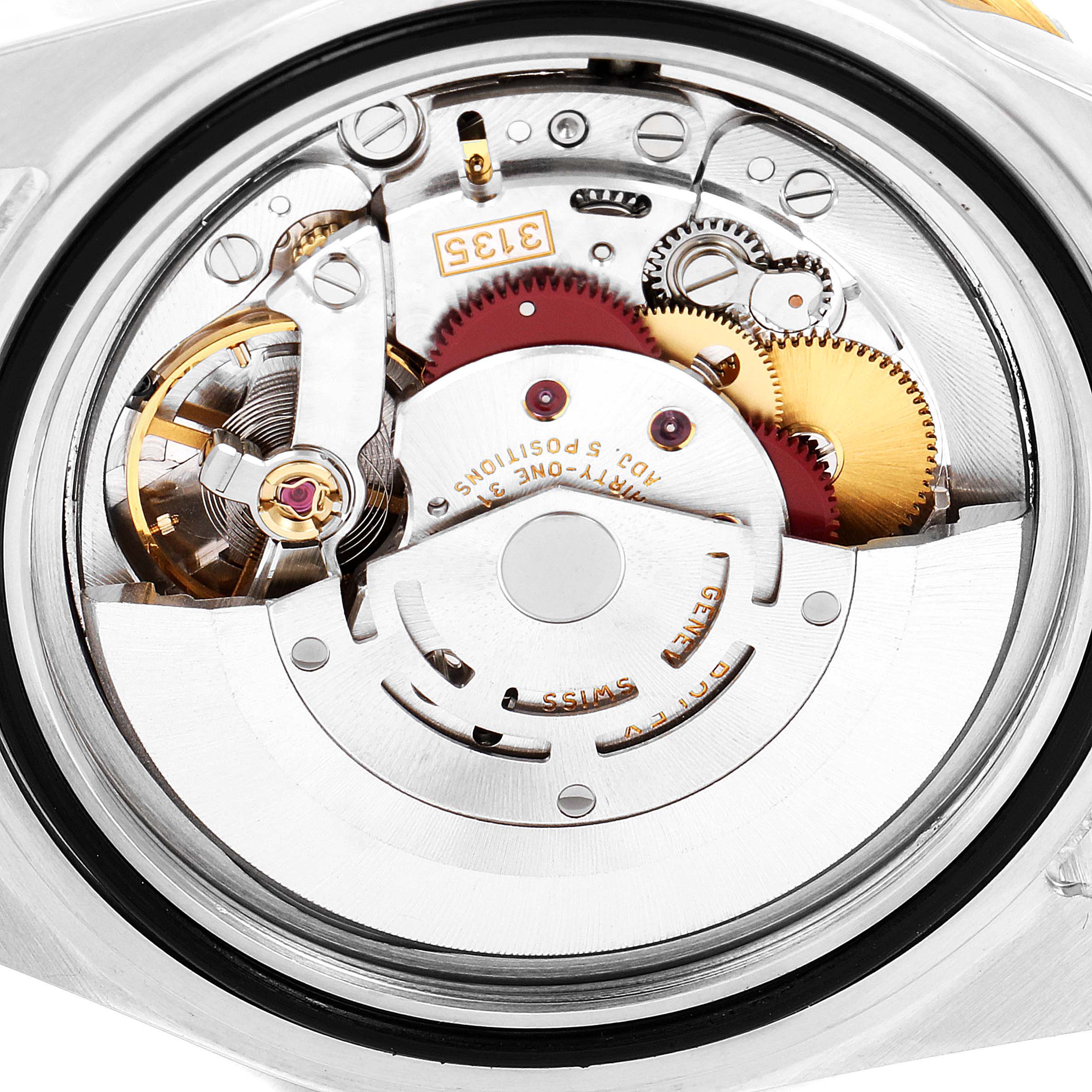 This image shows the intricate movement mechanics of the Rolex Submariner 16613 Men
s Steel and Gold (two tone) Blue Dial 16613 Men
s Steel and Gold (two tone) Blue Dial watch from a back angle.