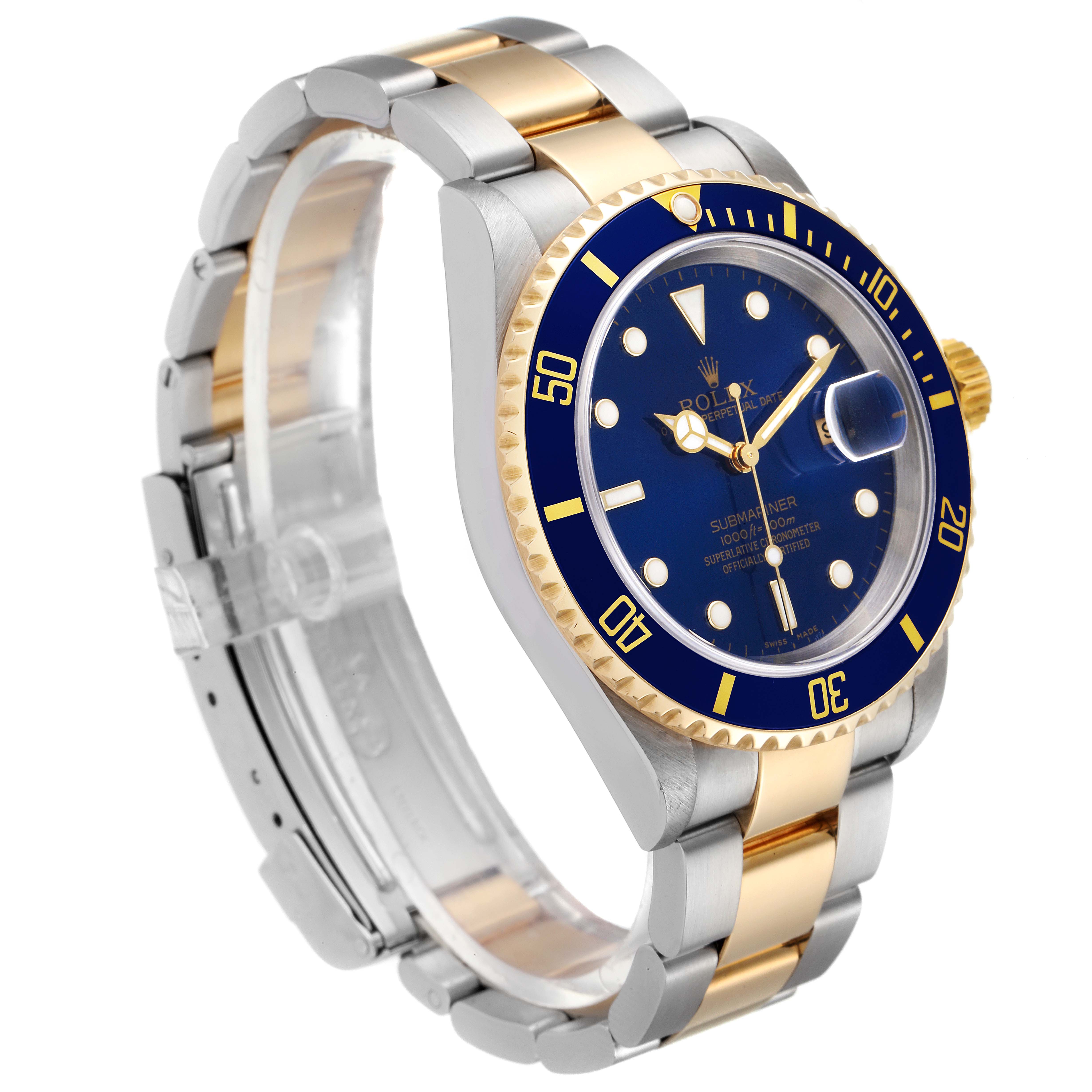 The Rolex Submariner 16613 Men
s Steel and Gold (two tone) Blue Dial 16613 Men
s Steel and Gold (two tone) Blue Dial watch is shown at an angle displaying its blue dial, bezel, two-tone bracelet, and crown.