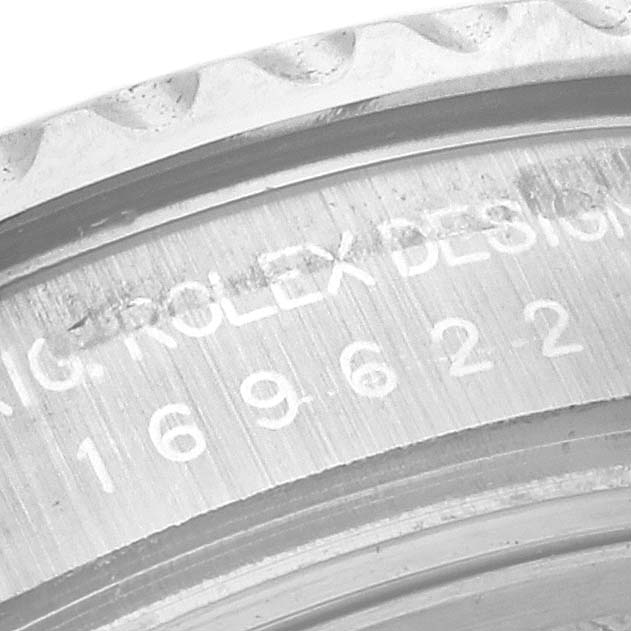 This is a close-up view of the Rolex Yacht-Master 169622 Women
s Stainless Steel Silver Dial 169622 Women
s Stainless Steel Silver Dial model
s engraved bezel and serial number.