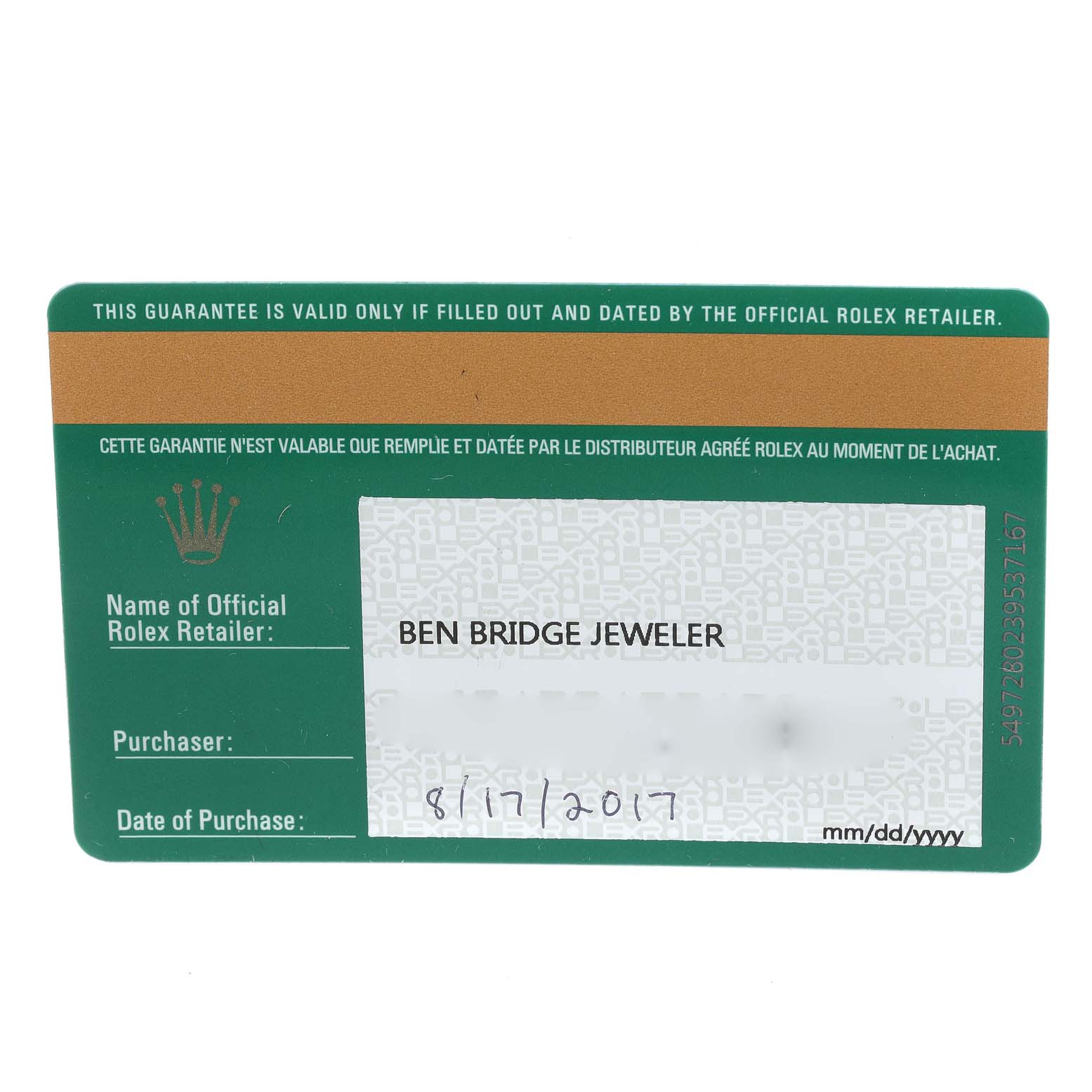 This image shows a guarantee card for a Rolex Yacht-Master 116621 Men's Steel and Gold (two tone) Brown Dial 116621 Men's Steel and Gold (two tone) Brown Dial watch from an overhead angle.