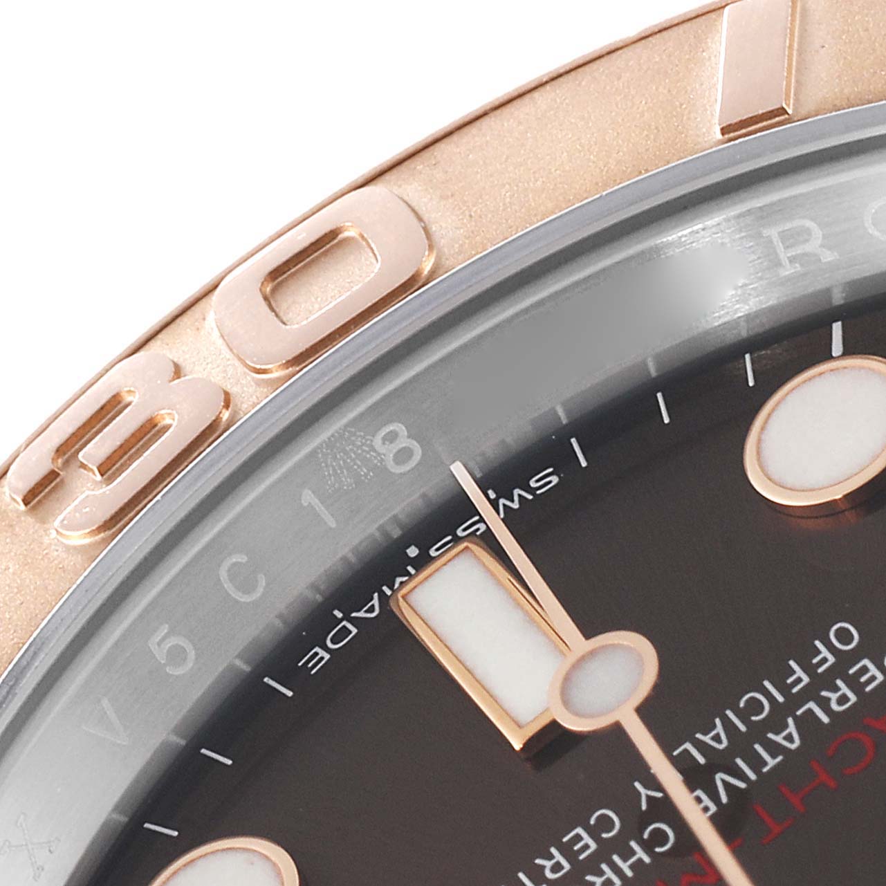 The image shows a close-up of the face and bezel of a Rolex Yacht-Master 116621 Men's Steel and Gold (two tone) Brown Dial 116621 Men's Steel and Gold (two tone) Brown Dial watch, highlighting the markers and part of the dial.