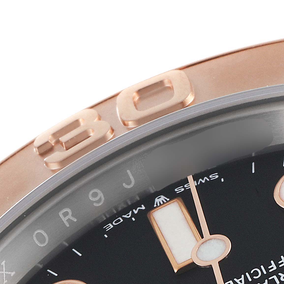 This close-up shows the bezel, part of the dial, and hands of the Rolex Yacht-Master 126621 Men
s Steel and Gold (two tone) Black Dial 126621 Men
s Steel and Gold (two tone) Black Dial watch from an angled perspective.