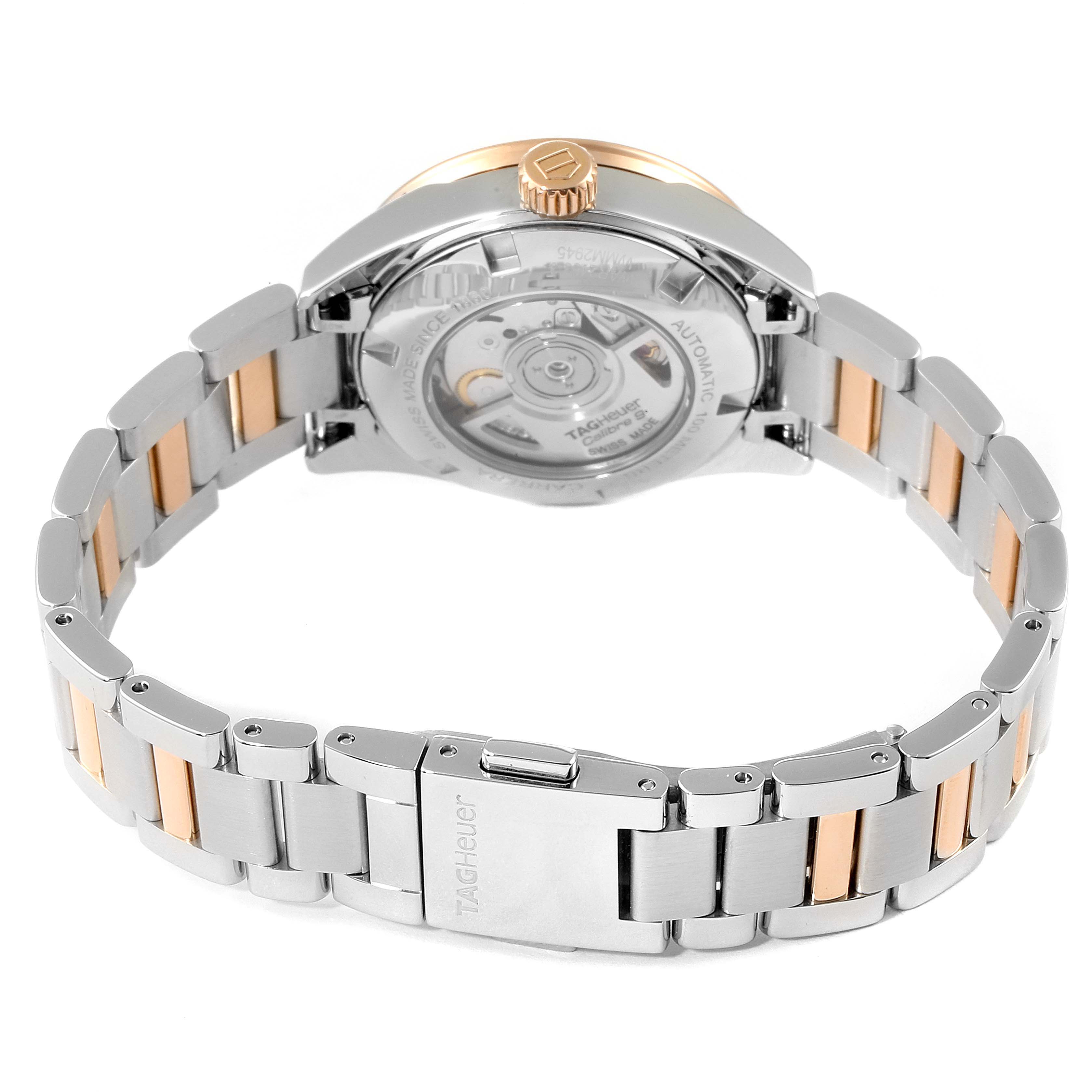 The image shows the back view of a Tag Heuer Carrera WAR2453.BD0777 Women's Steel and Gold (two tone) Mother of Pearl Dial WAR2453.BD0777 Women's Steel and Gold (two tone) Mother of Pearl Dial watch, highlighting the bracelet and the automatic movement through the transparent case back.
