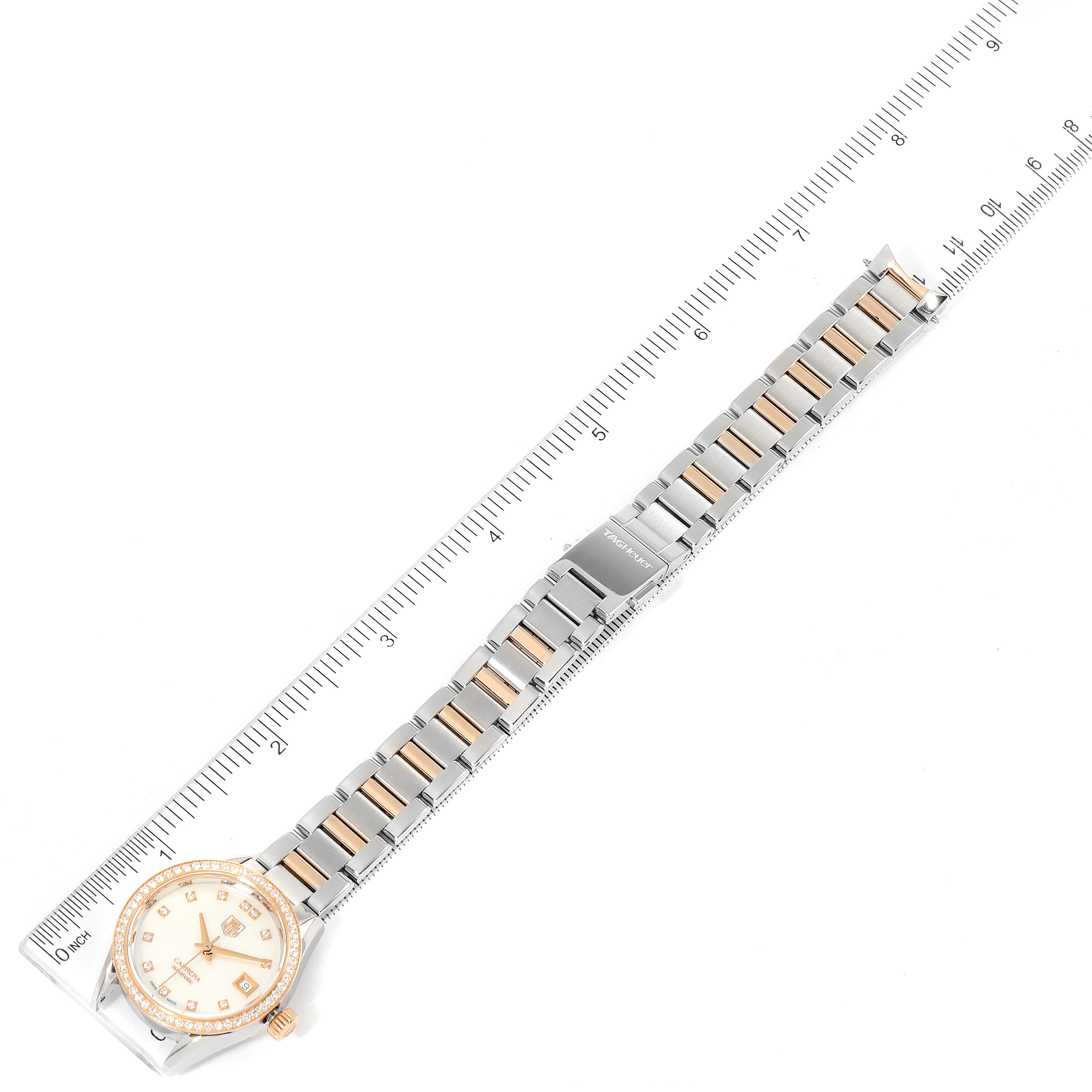 The image shows a Tag Heuer Carrera WAR2453.BD0777 Women's Steel and Gold (two tone) Mother of Pearl Dial WAR2453.BD0777 Women's Steel and Gold (two tone) Mother of Pearl Dial watch laid flat with a ruler alongside it, highlighting the full length and bracelet.