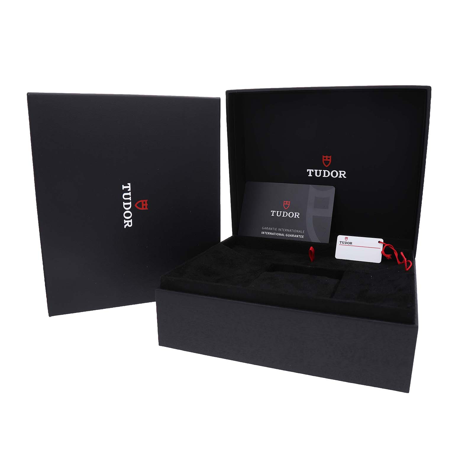 The image shows the open packaging for the Tudor Heritage Black Bay 79377KN Men's Titanium White Dial, with an international guarantee card and a hang tag included.