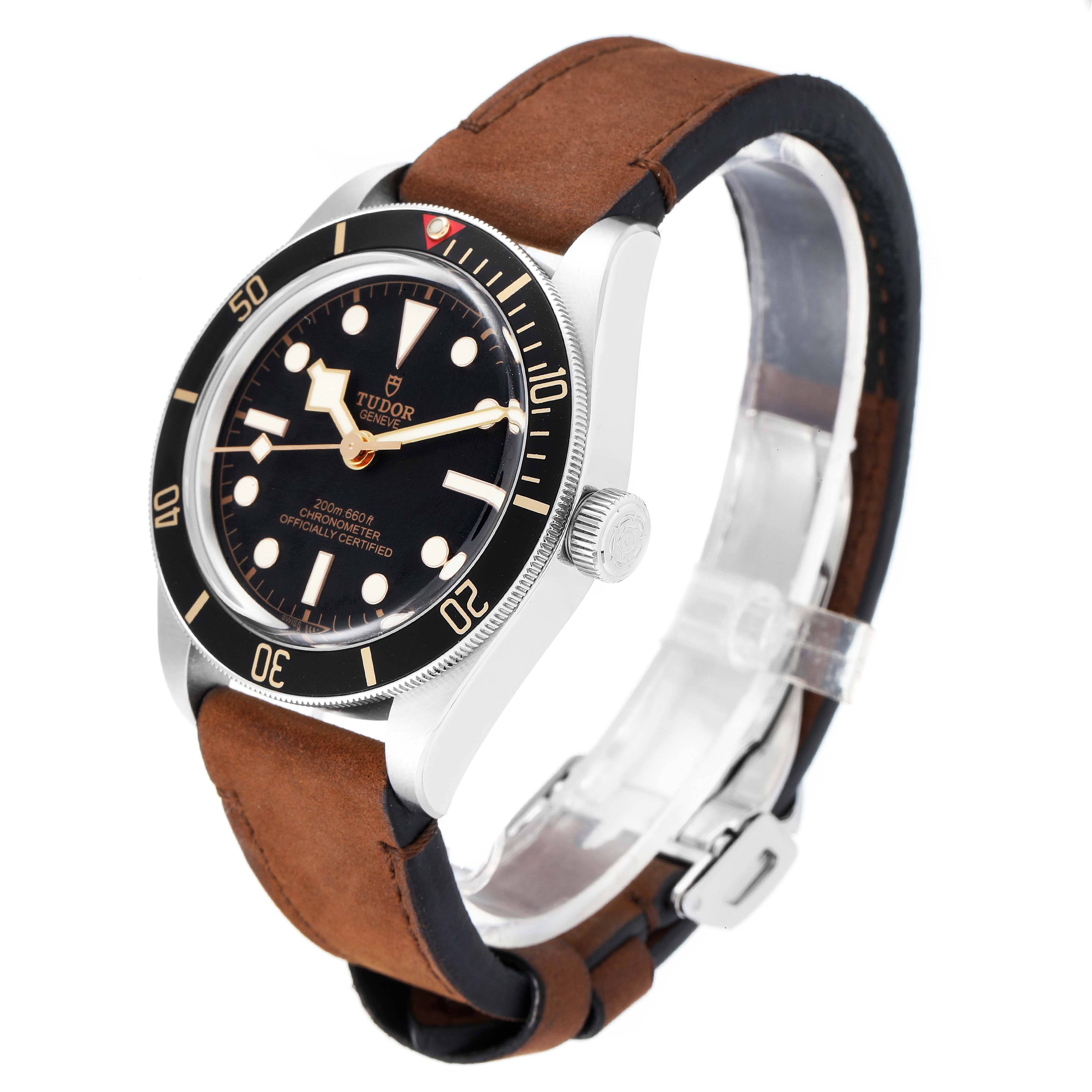The Tudor Heritage Black Bay 79030N Men's Stainless Steel Black Dial 79030N Men's Stainless Steel Black Dial is shown from a three-quarter angle displaying the dial, bezel, crown, and brown leather strap.