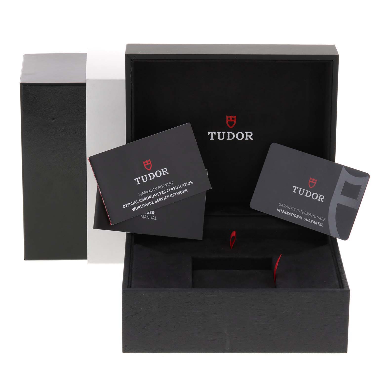 The image shows the open packaging of a Tudor Heritage Black Bay 79030N Men's Stainless Steel Black Dial 79030N Men's Stainless Steel Black Dial watch, including warranty cards and booklets.