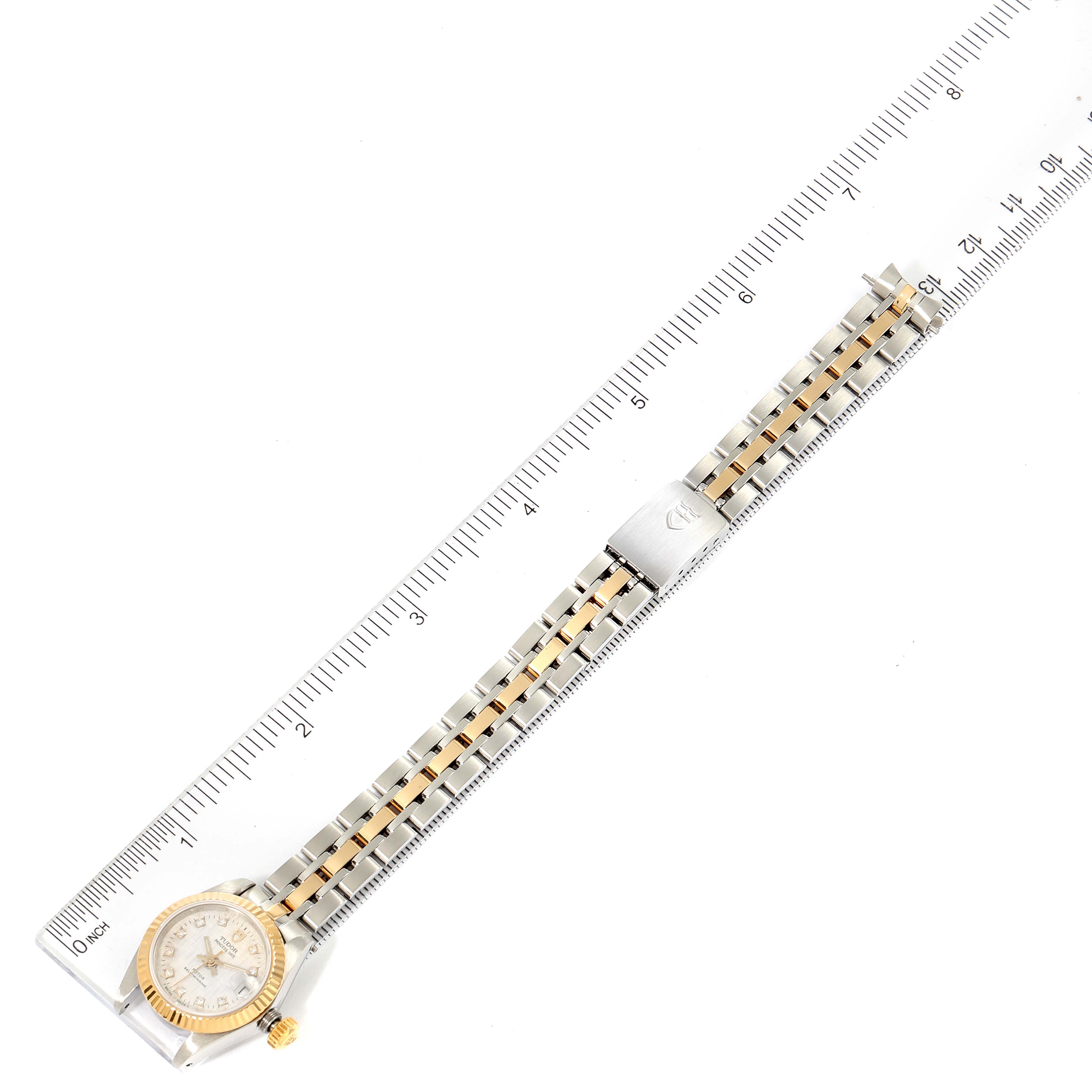 The image shows a top-down view of a Tudor Princess 92513 Women's Steel and Gold (two tone) Silver Dial 92513 Women's Steel and Gold (two tone) Silver Dial model watch, including its gold and silver link bracelet and face.