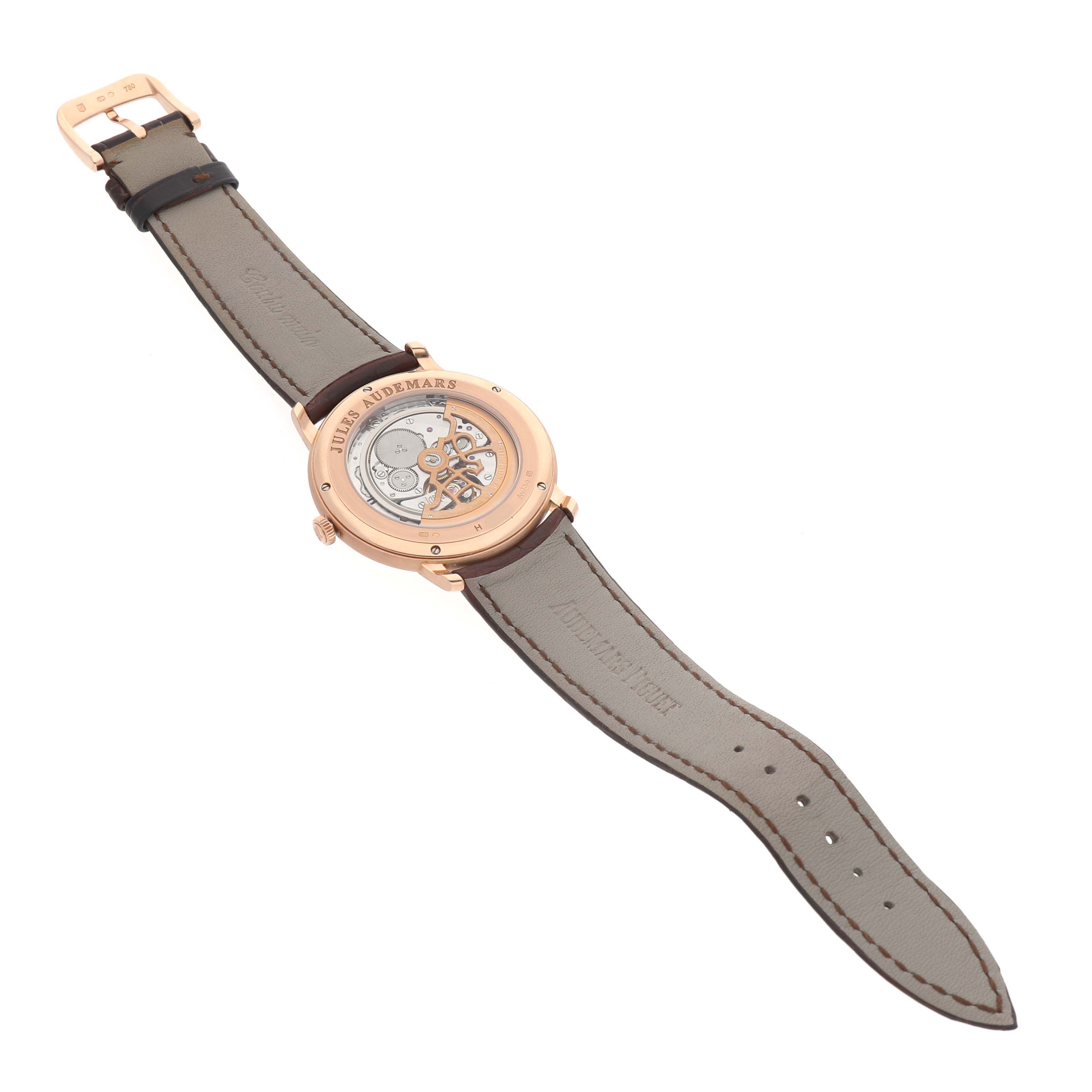 The Jules model by Audemars Piguet is shown from the back, highlighting the open case back and the inner mechanisms.