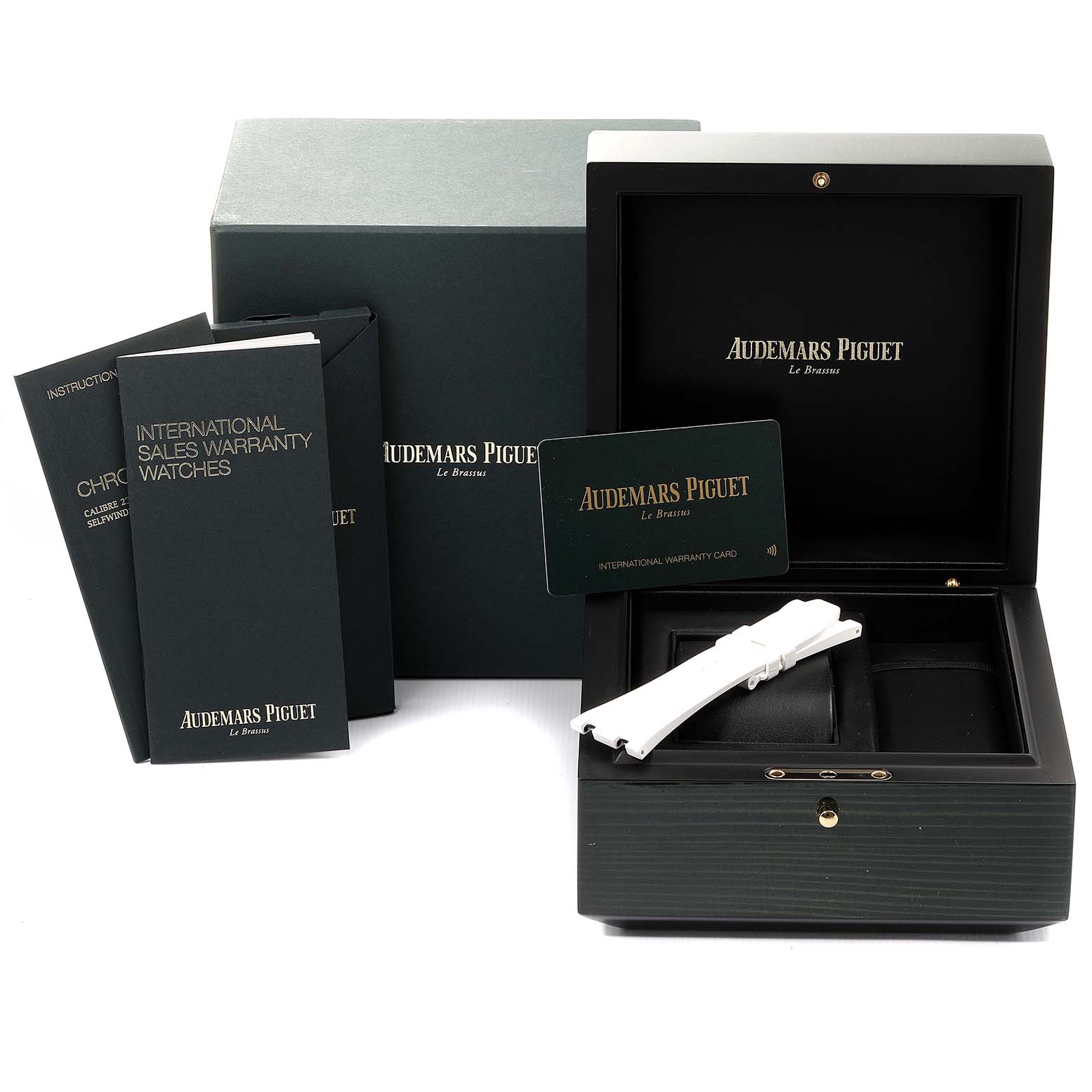 This image shows the box, warranty card, instructional booklets, and extra straps for the Audemars Piguet Royal Oak Offshore 26480TI.OO.A027CA.01 Men's Titanium Blue Dial 26480TI.OO.A027CA.01 Men's Titanium Blue Dial watch.