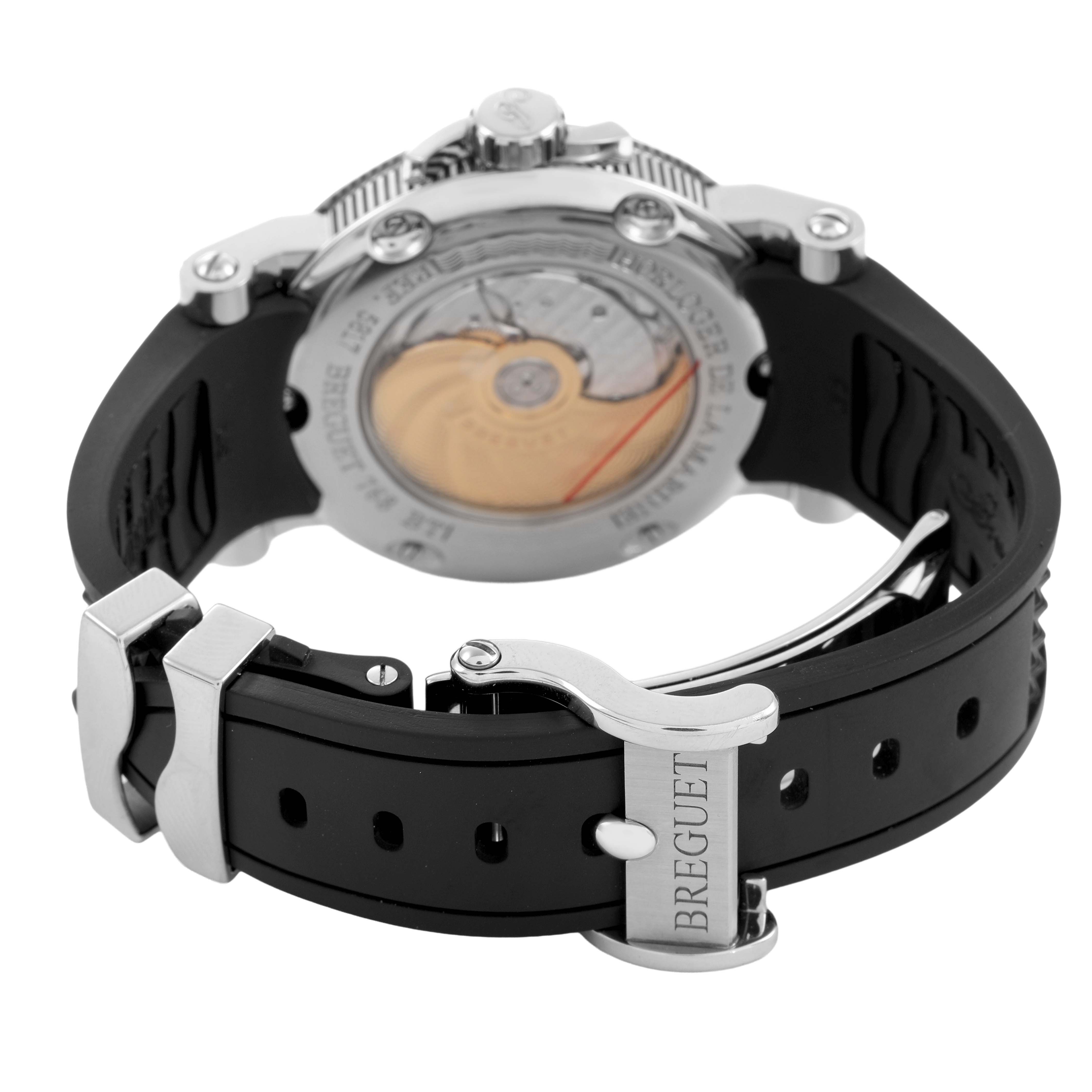 The Breguet Marine 5817ST/12/SVO Men's Stainless Steel Black Dial watch is shown from the back, highlighting the movement and rubber strap with "BREGUET" on the clasp.