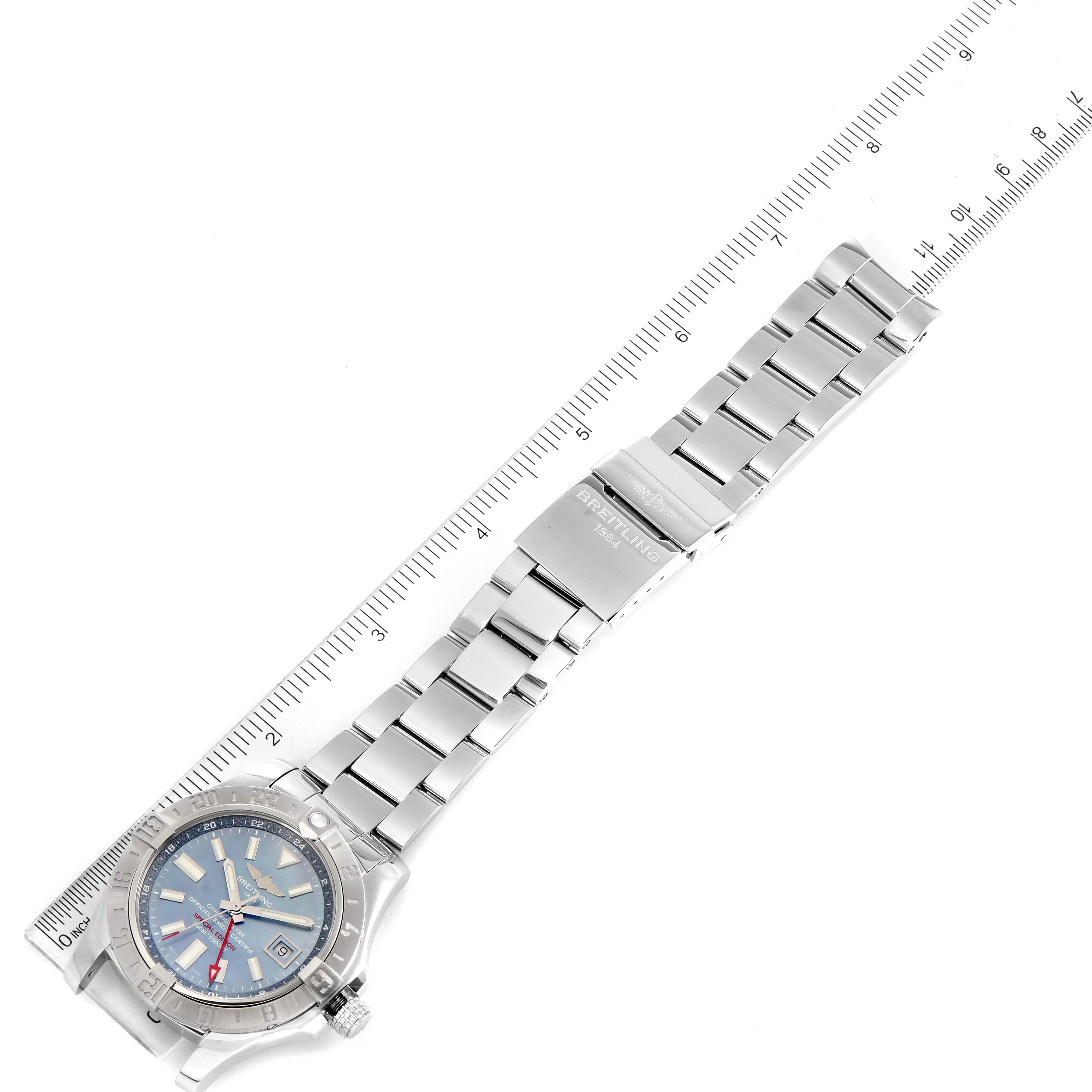 The Breitling Avenger A3239011-C872-170A Men
s Stainless Steel Mother of Pearl Dial A3239011-C872-170A Men
s Stainless Steel Mother of Pearl Dial watch is shown from a top-down angle, featuring the face, bracelet, and clasp alongside a ruler for scale.