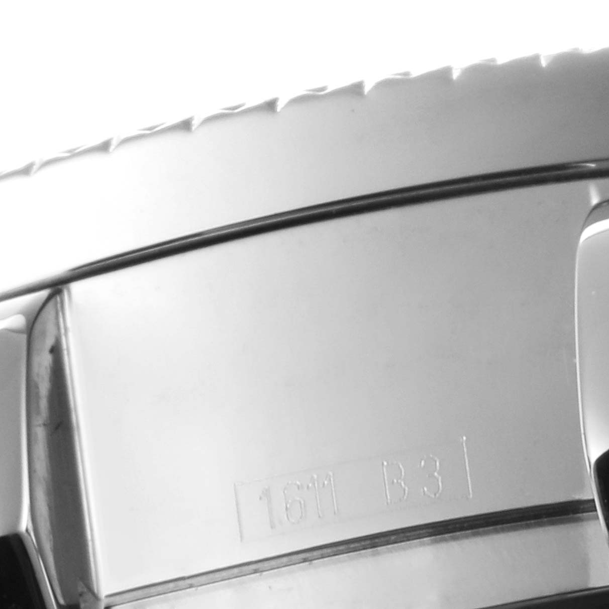 The image shows a close-up of the stainless steel buckle and part of the clasp of a Bentley model by Breitling.