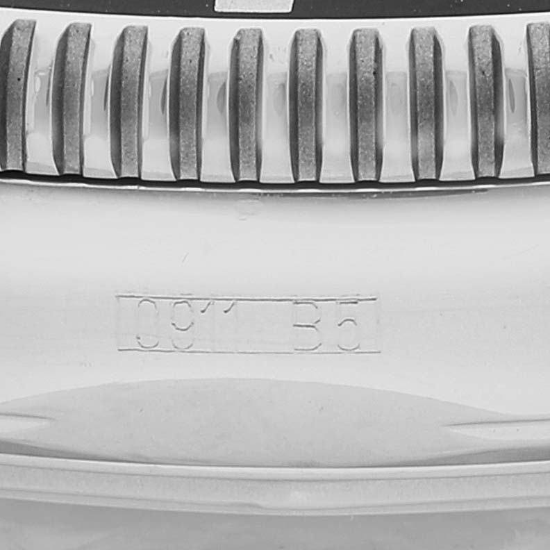 The image shows a close-up of the bezel teeth and side of the case of a Breitling Superocean A17321 Men's Stainless Steel White Dial A17321 Men's Stainless Steel White Dial watch.