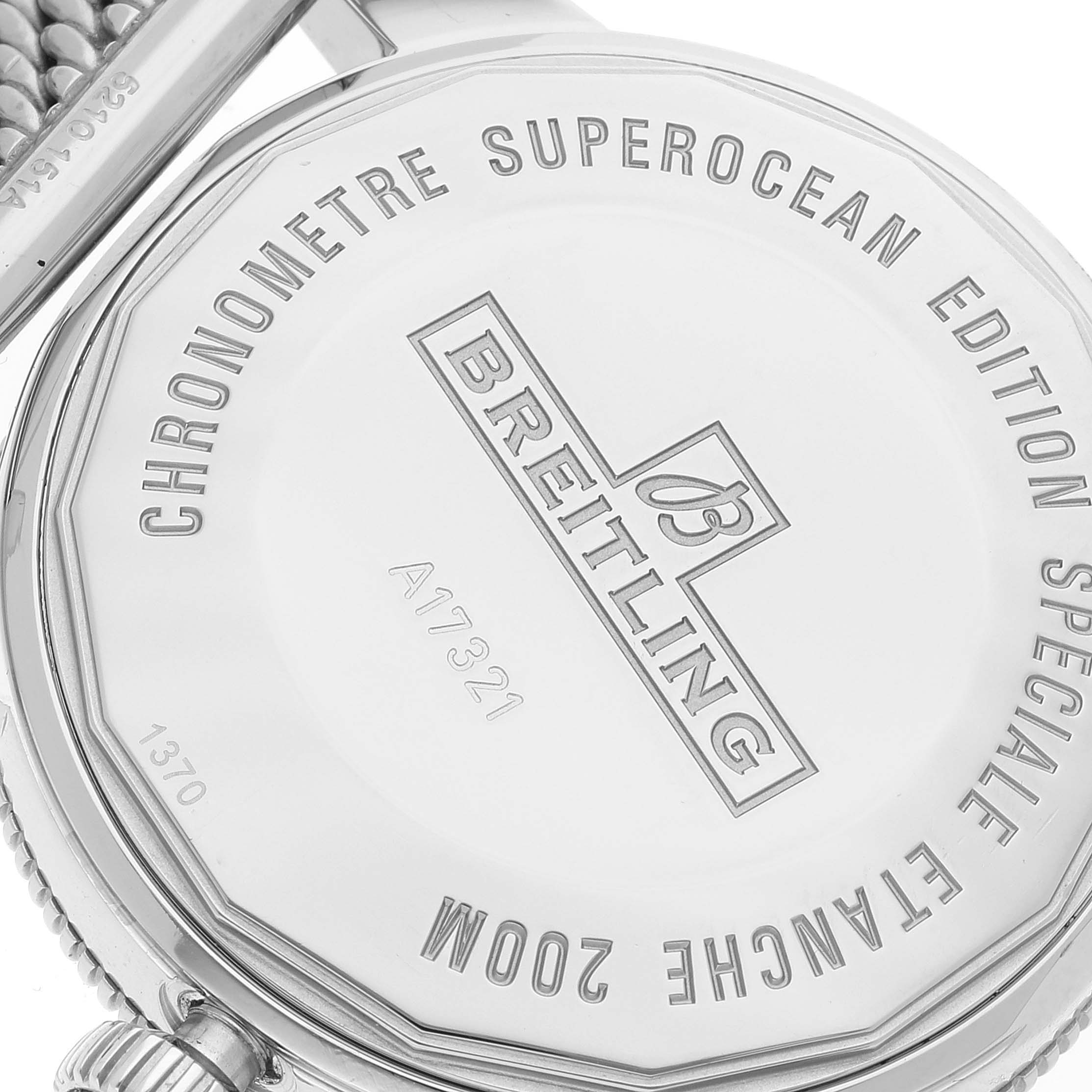 The image shows the back case of a Breitling Superocean A17321 Men's Stainless Steel White Dial A17321 Men's Stainless Steel White Dial watch, highlighting engravings and the crown.