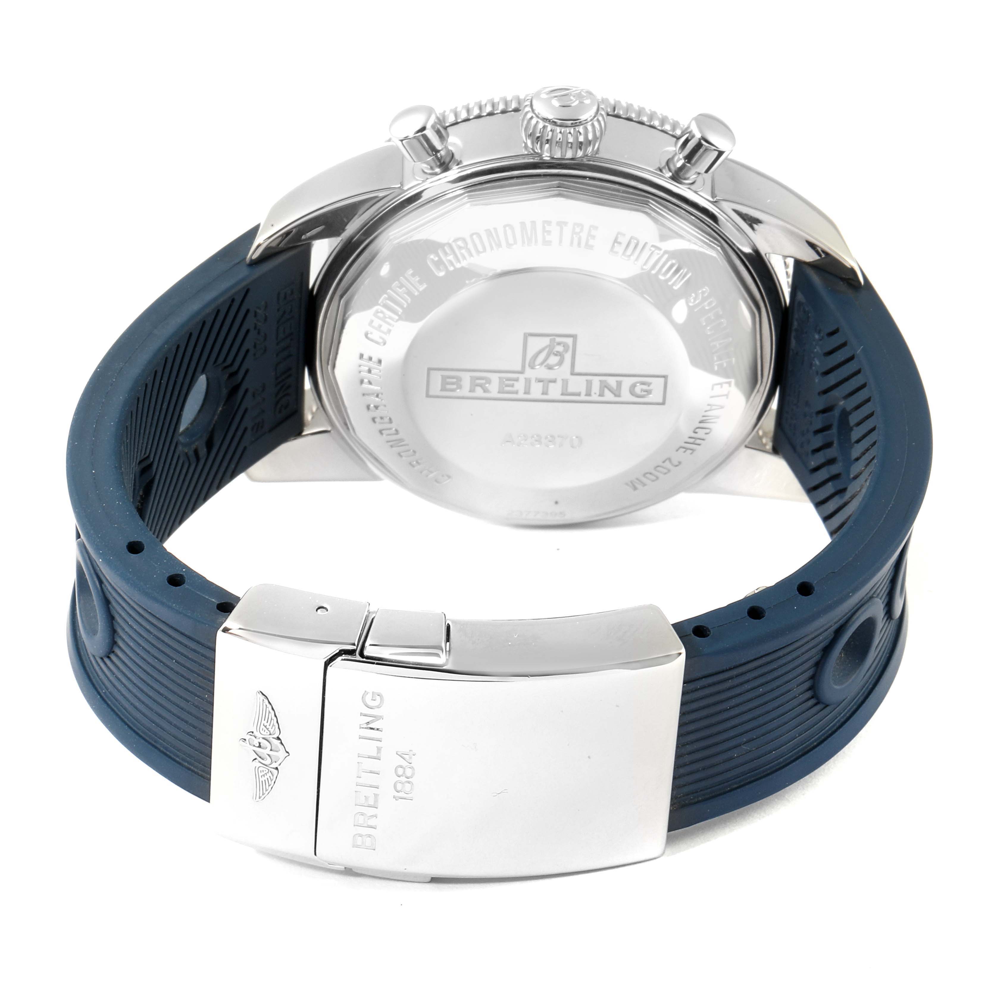 The image shows the back view of a Breitling Superocean A23370 Men's Stainless Steel Blue Dial A23370 Men's Stainless Steel Blue Dial watch, featuring its case back, crown, and blue rubber strap with a clasp.