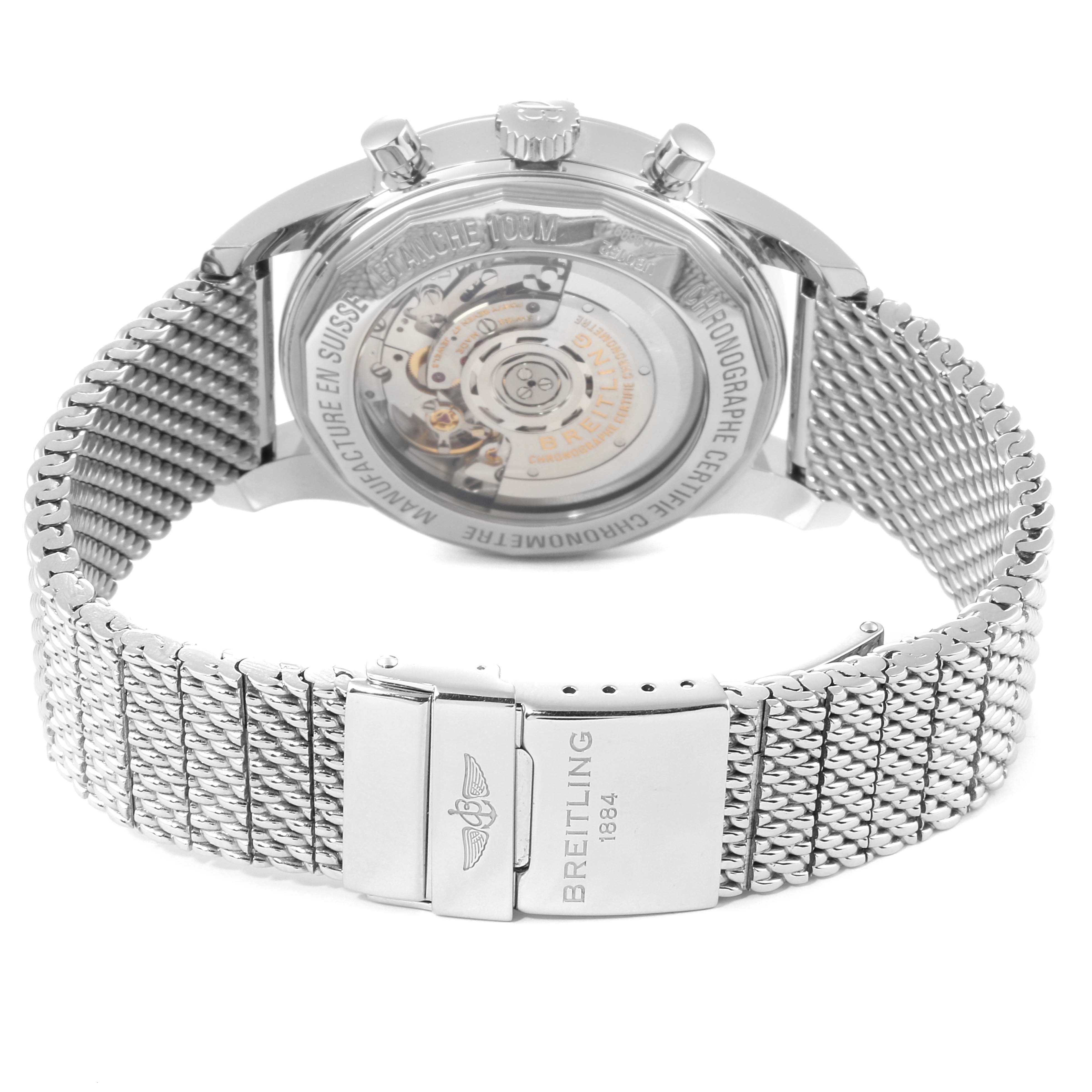 The image shows the back view of a Breitling Transocean UB015212/BC74-SS Men's Steel and Gold (two tone) Black Dial UB015212/BC74-SS Men's Steel and Gold (two tone) Black Dial watch, featuring its movement and stainless steel mesh bracelet clasp.