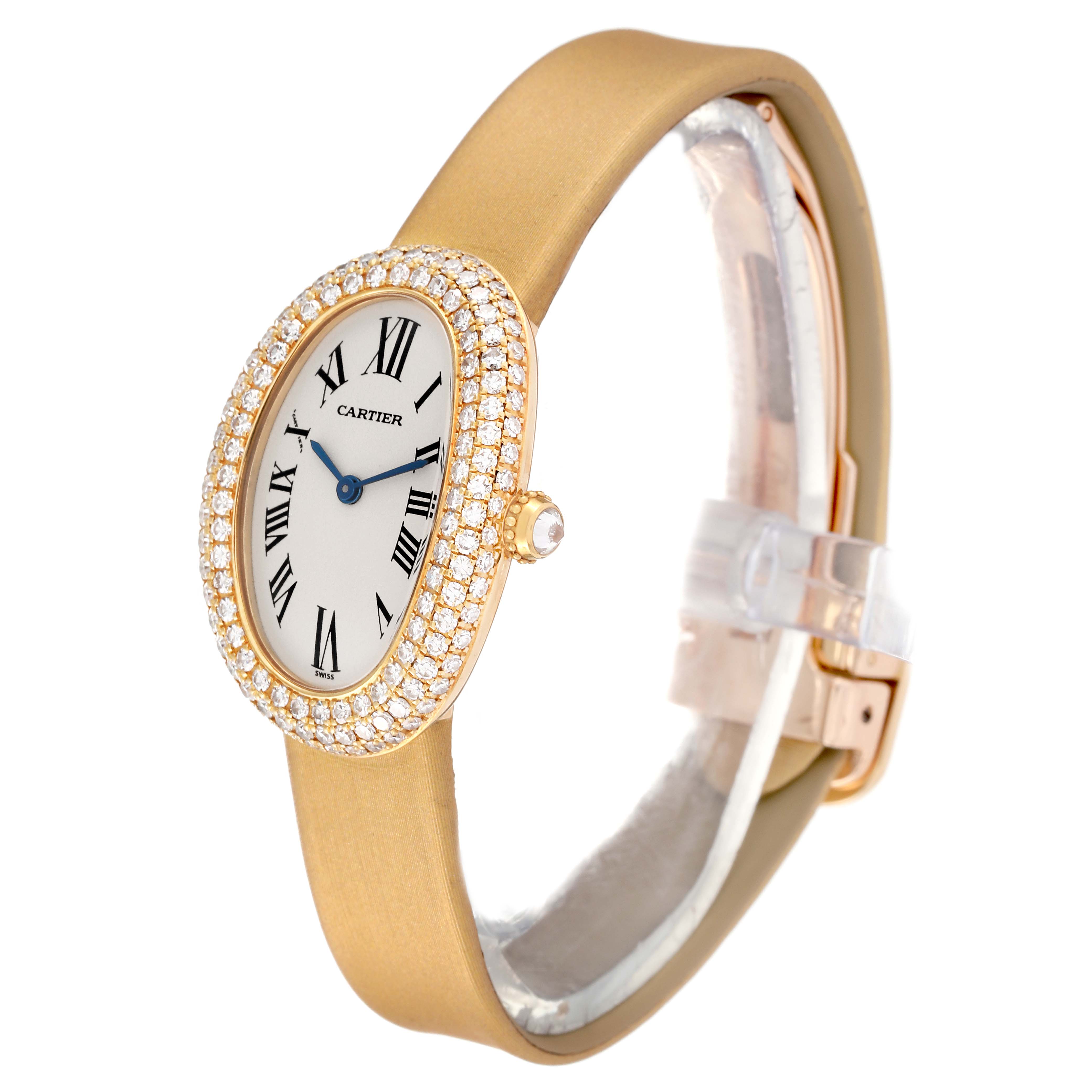The Cartier Baignoire 1954 Women's Yellow Gold Silver Dial 1954 Women's Yellow Gold Silver Dial watch is shown at a slight side angle, highlighting its oval dial, Roman numeral indices, and diamond-encrusted bezel.