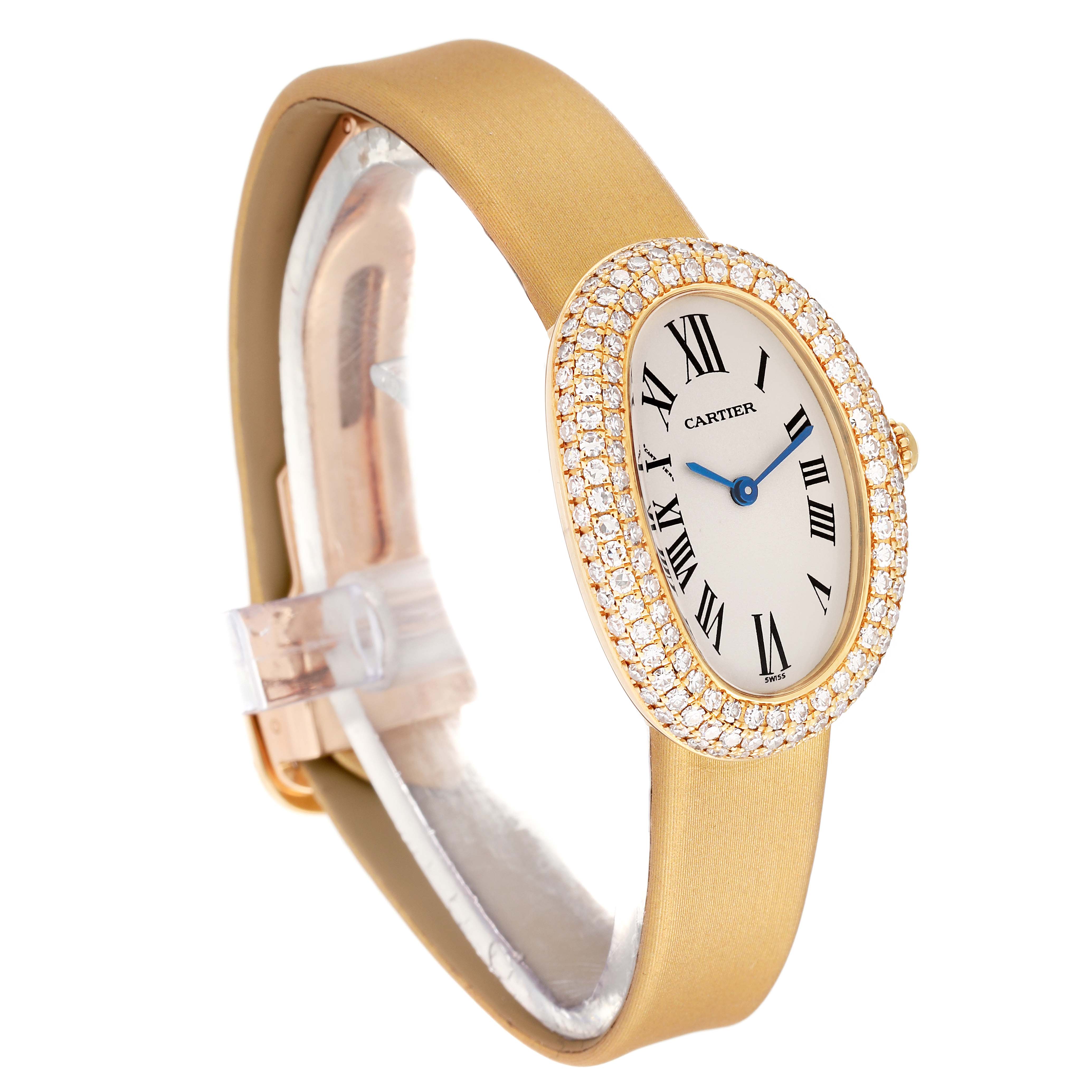 The image shows a side angle of the Cartier Baignoire 1954 Women's Yellow Gold Silver Dial 1954 Women's Yellow Gold Silver Dial watch, highlighting its oval face, diamond bezel, and beige strap.