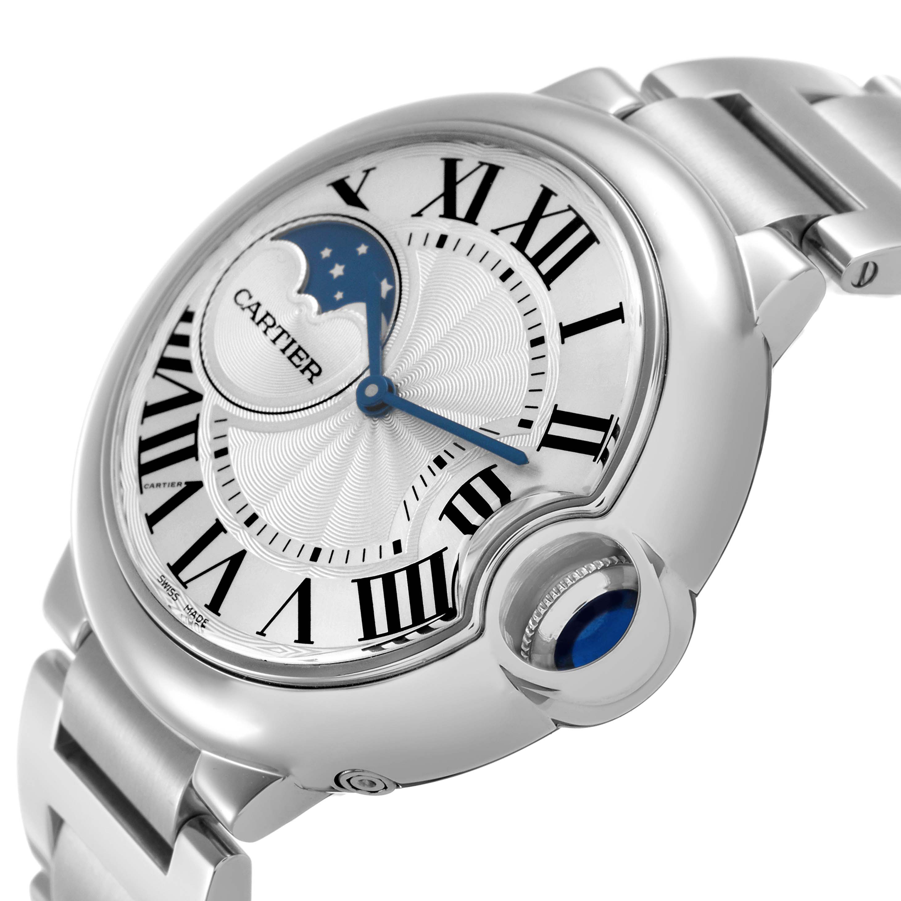 The Cartier Ballon Bleu WSBB0021 Men's Stainless Steel Silver Dial watch is shown from a three-quarter angle, highlighting its Roman numerals, blue hands, and the crown with cabochon.