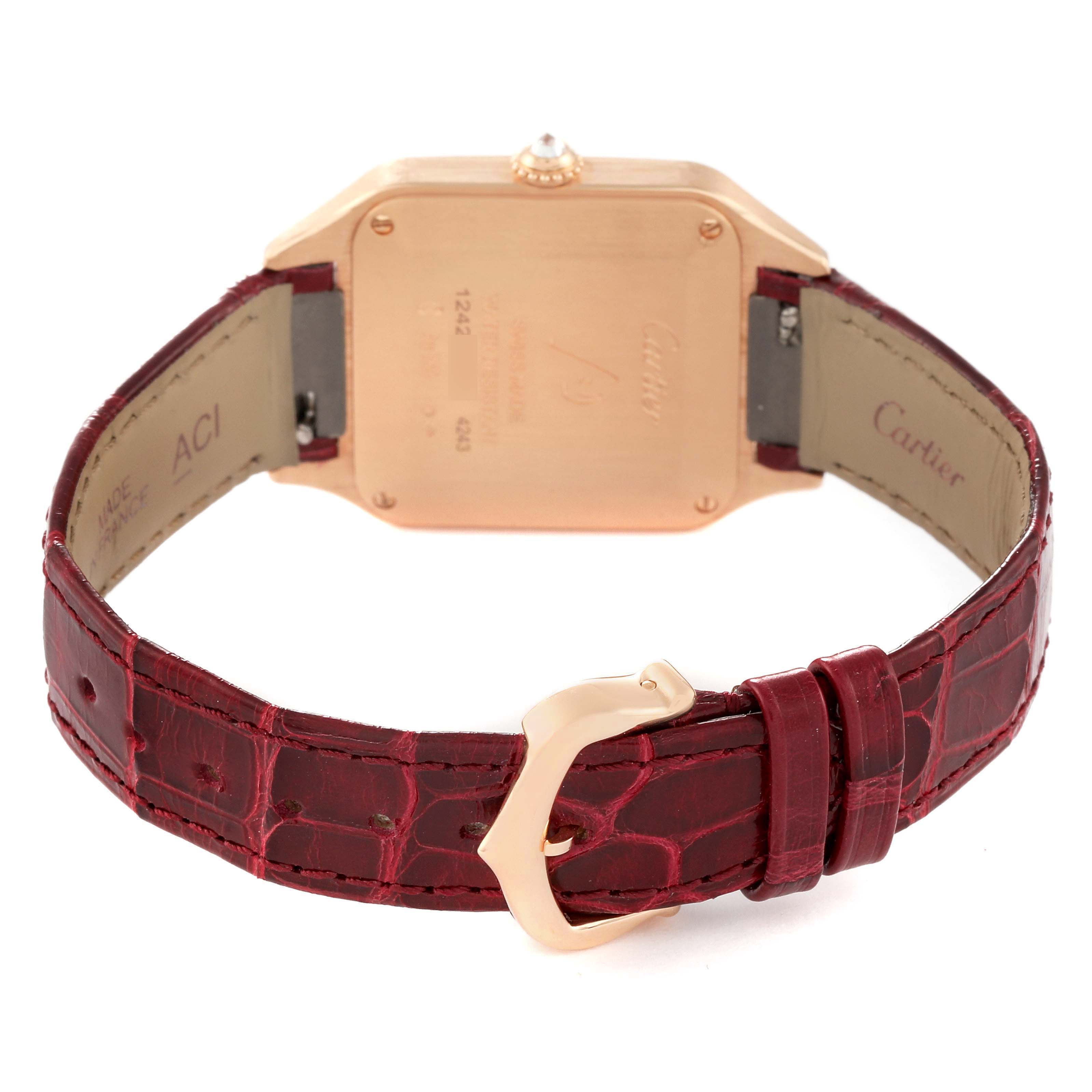 The image shows the back of a Cartier Santos WJSA0017 Women's Rose Gold Silver Dial watch with a brown leather strap and a gold buckle, viewed from the back angle.