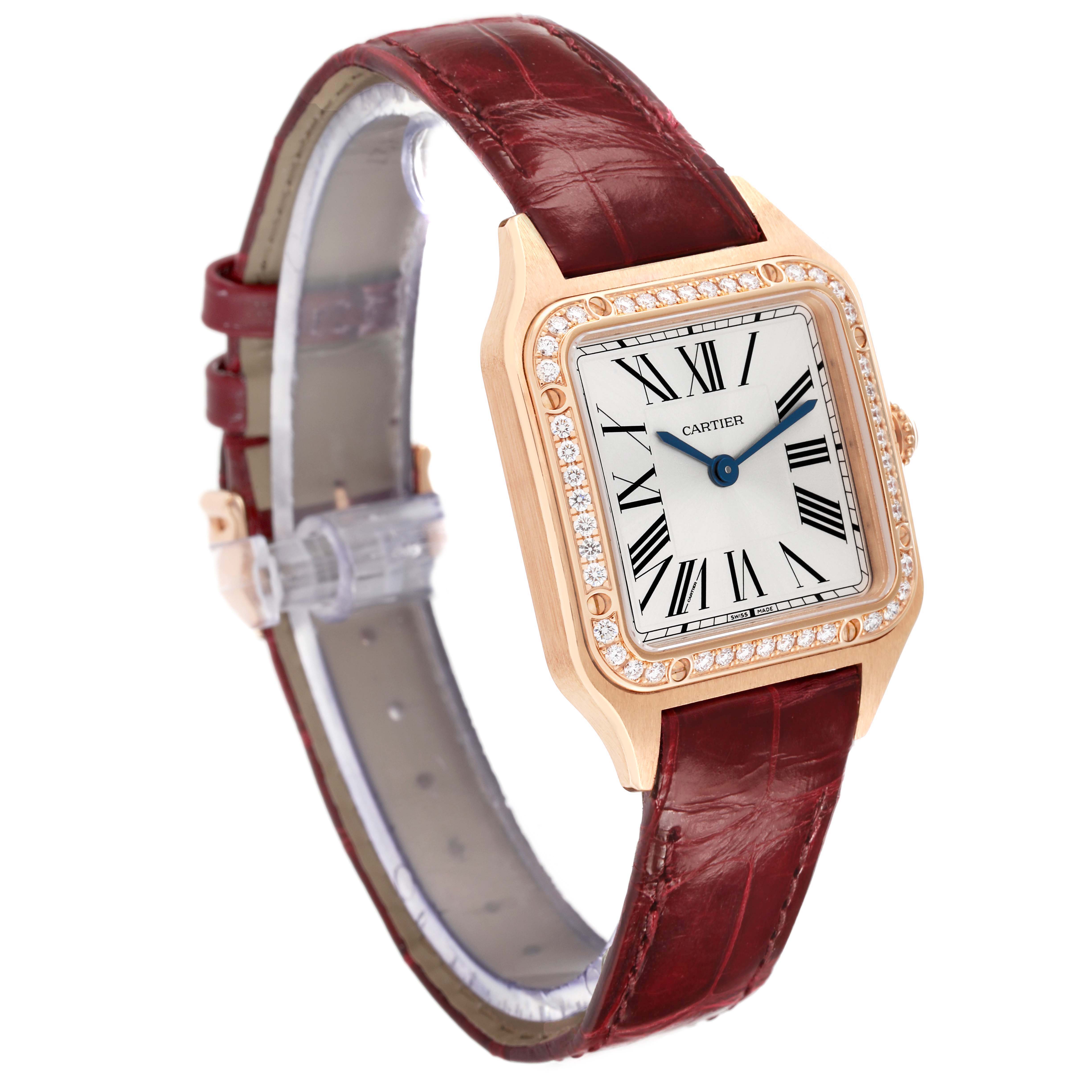 The Cartier Santos WJSA0017 Women's Rose Gold Silver Dial watch is shown at a three-quarter angle displaying the face, bezel with diamonds, and burgundy leather strap.
