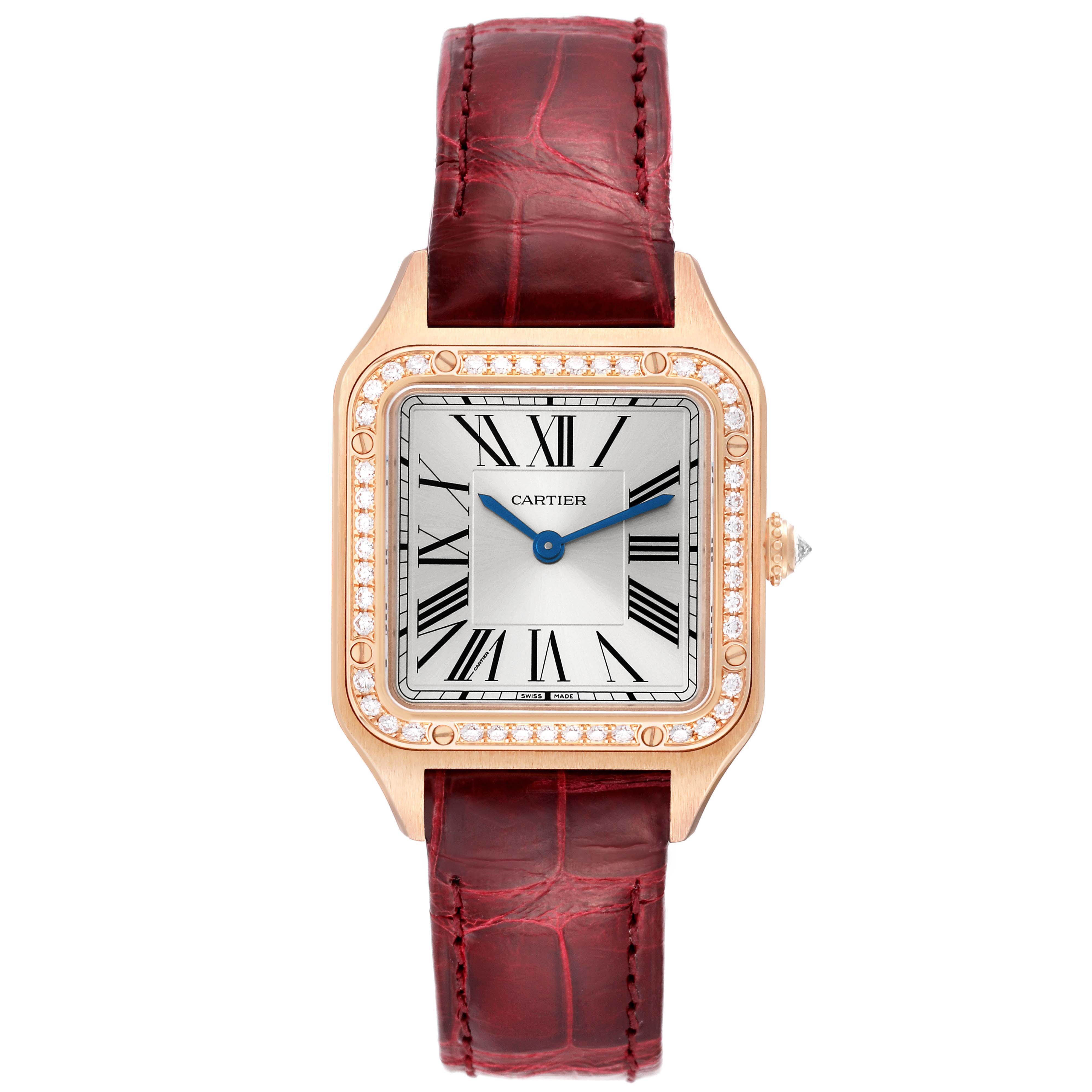 The Cartier Santos WJSA0017 Women's Rose Gold Silver Dial watch is shown from a front angle, highlighting its face, bezel with diamonds, and red strap.