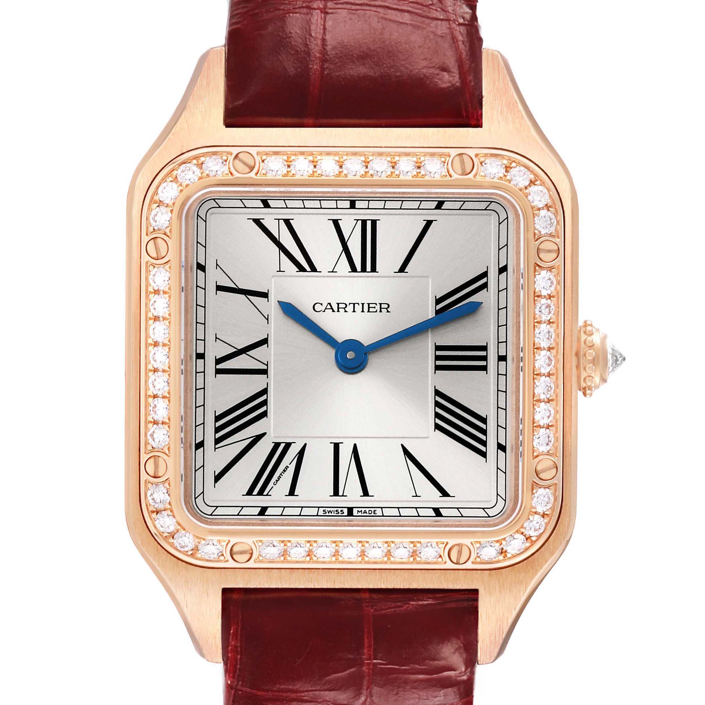 The Cartier Santos WJSA0017 Women's Rose Gold Silver Dial watch is shown from the front, highlighting its square dial, Roman numerals, and diamond-studded bezel.