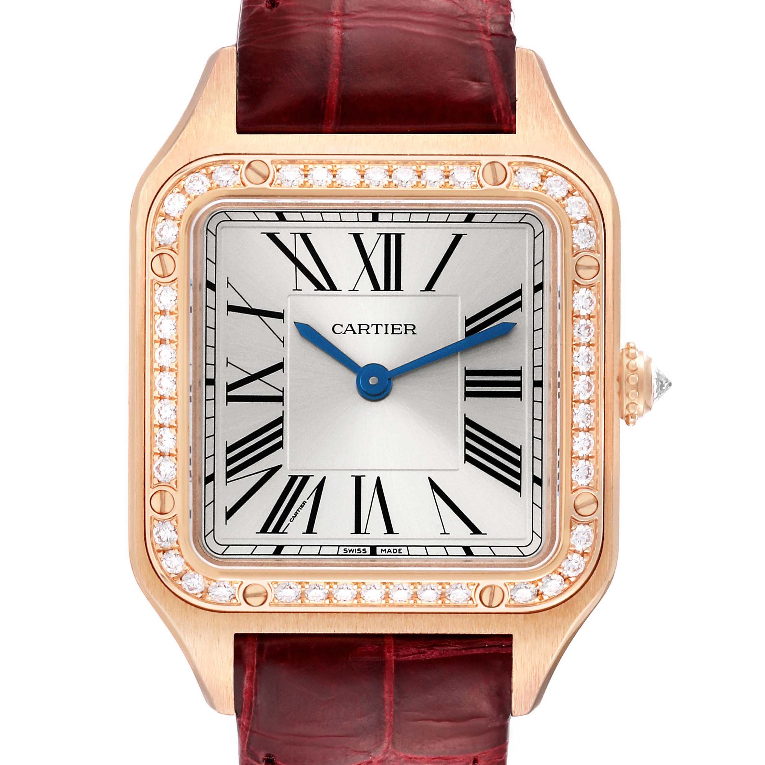 The Cartier Santos WJSA0017 Women's Rose Gold Silver Dial watch is shown from a frontal angle, highlighting its square face, diamond bezel, Roman numerals, and red leather strap.
