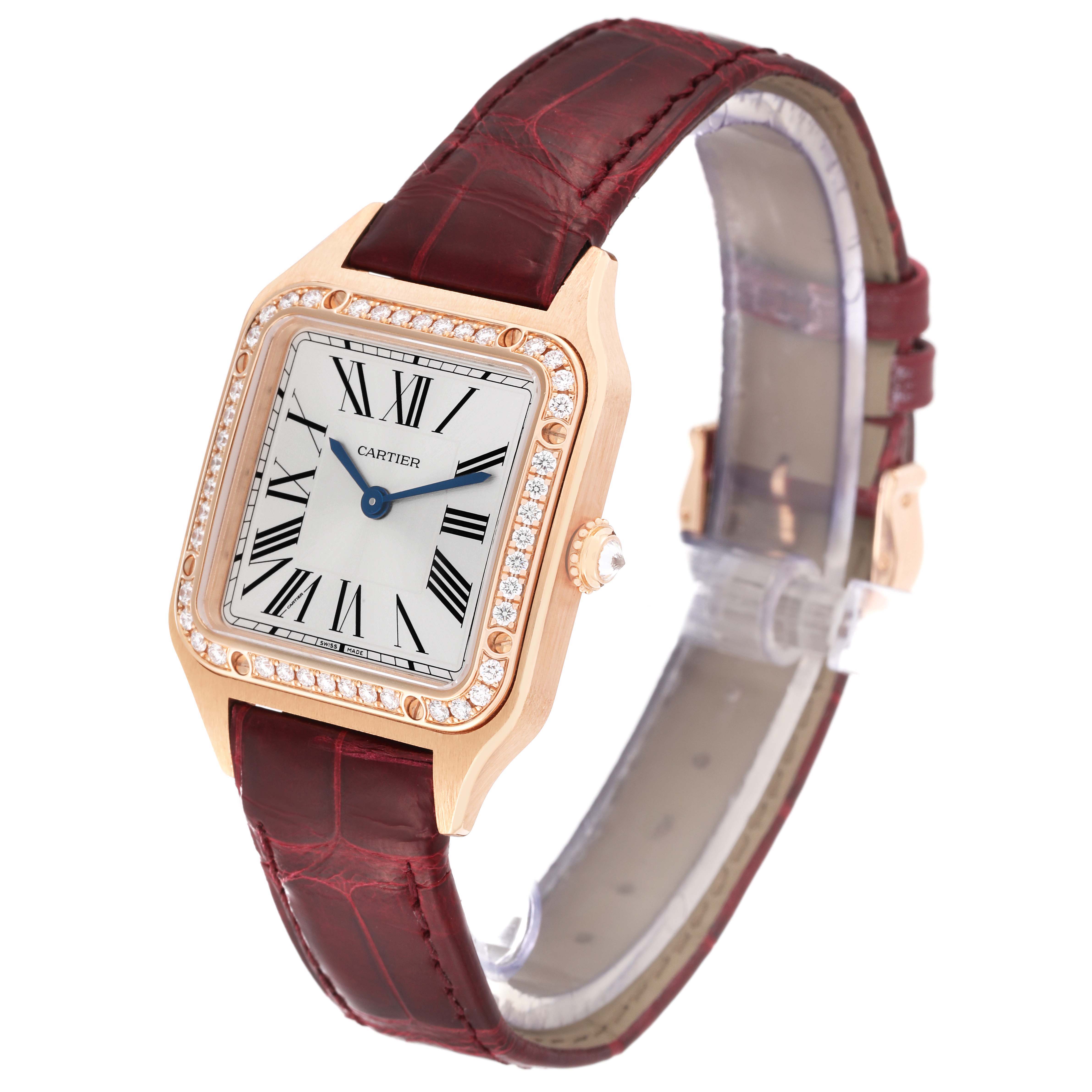 The Cartier Santos WJSA0017 Women's Rose Gold Silver Dial watch is shown at a three-quarter angle, highlighting the face, bezel, crown, and strap.
