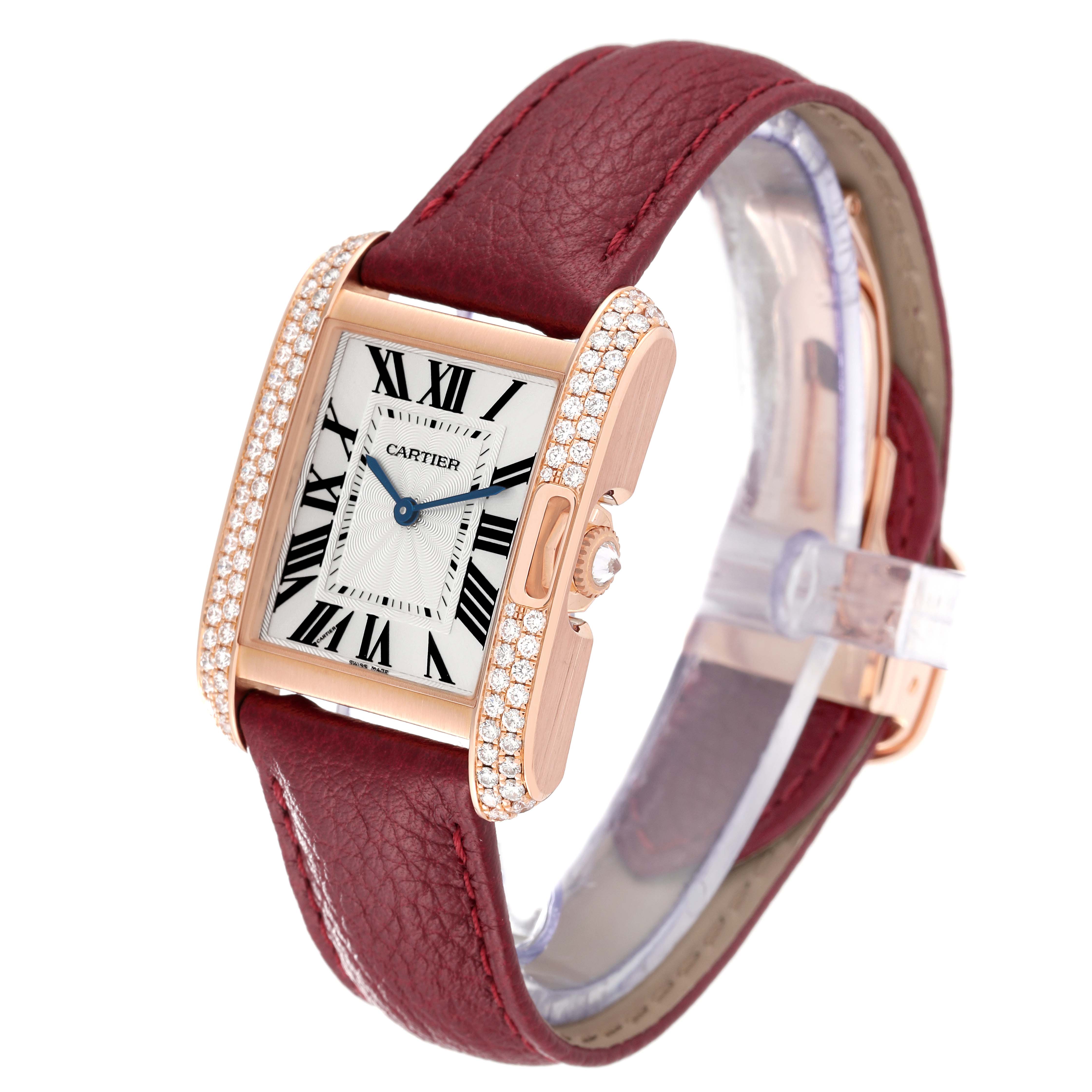 This Cartier Tank Anglaise WT100029 Women
s Rose Gold Silver Dial WT100029 Women
s Rose Gold Silver Dial watch is displayed at an angle showing the face, bezel with diamonds, and maroon leather strap.