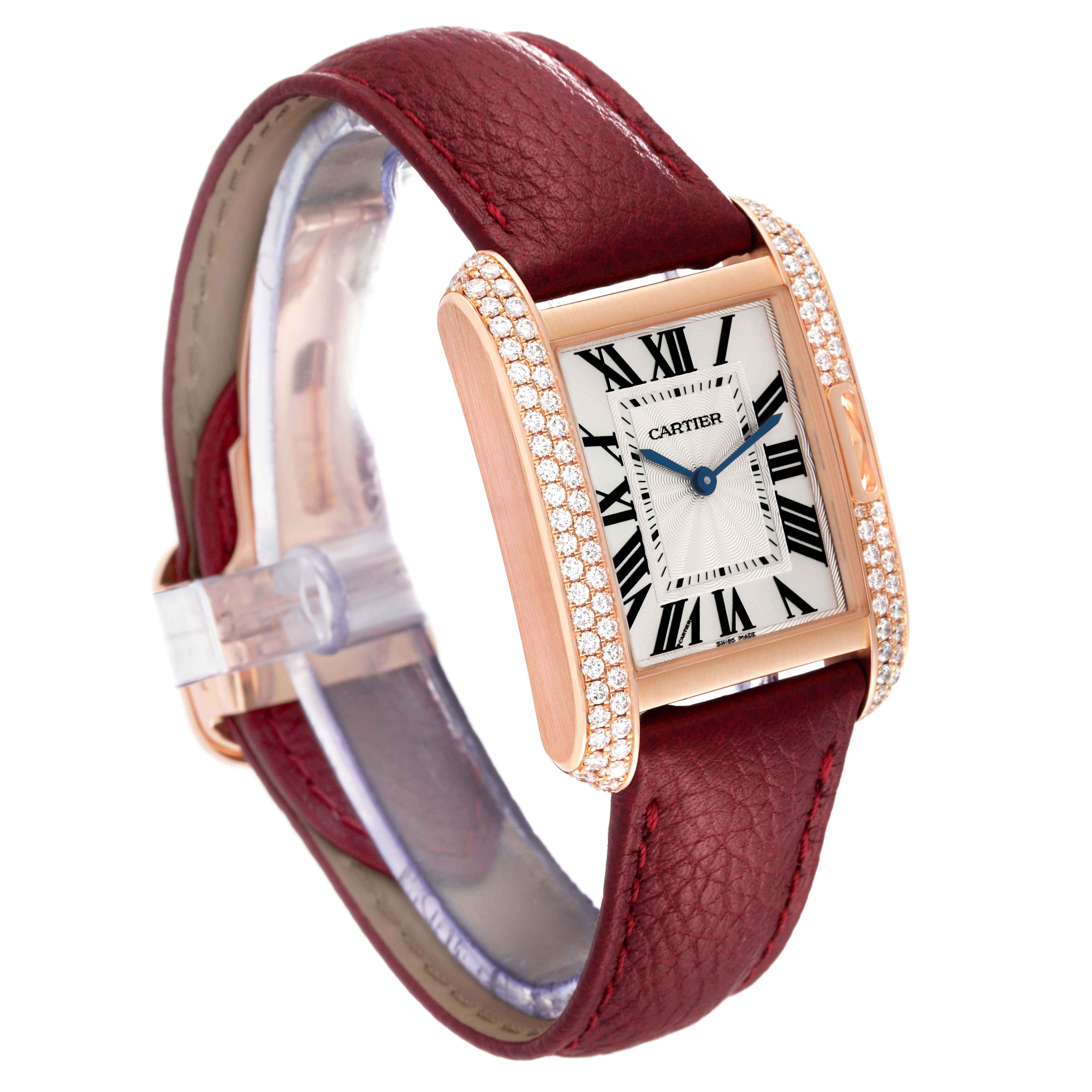 The image shows a Cartier Tank Anglaise WT100029 Women
s Rose Gold Silver Dial WT100029 Women
s Rose Gold Silver Dial watch angled from the top right, displaying its face, strap, and bejeweled case.