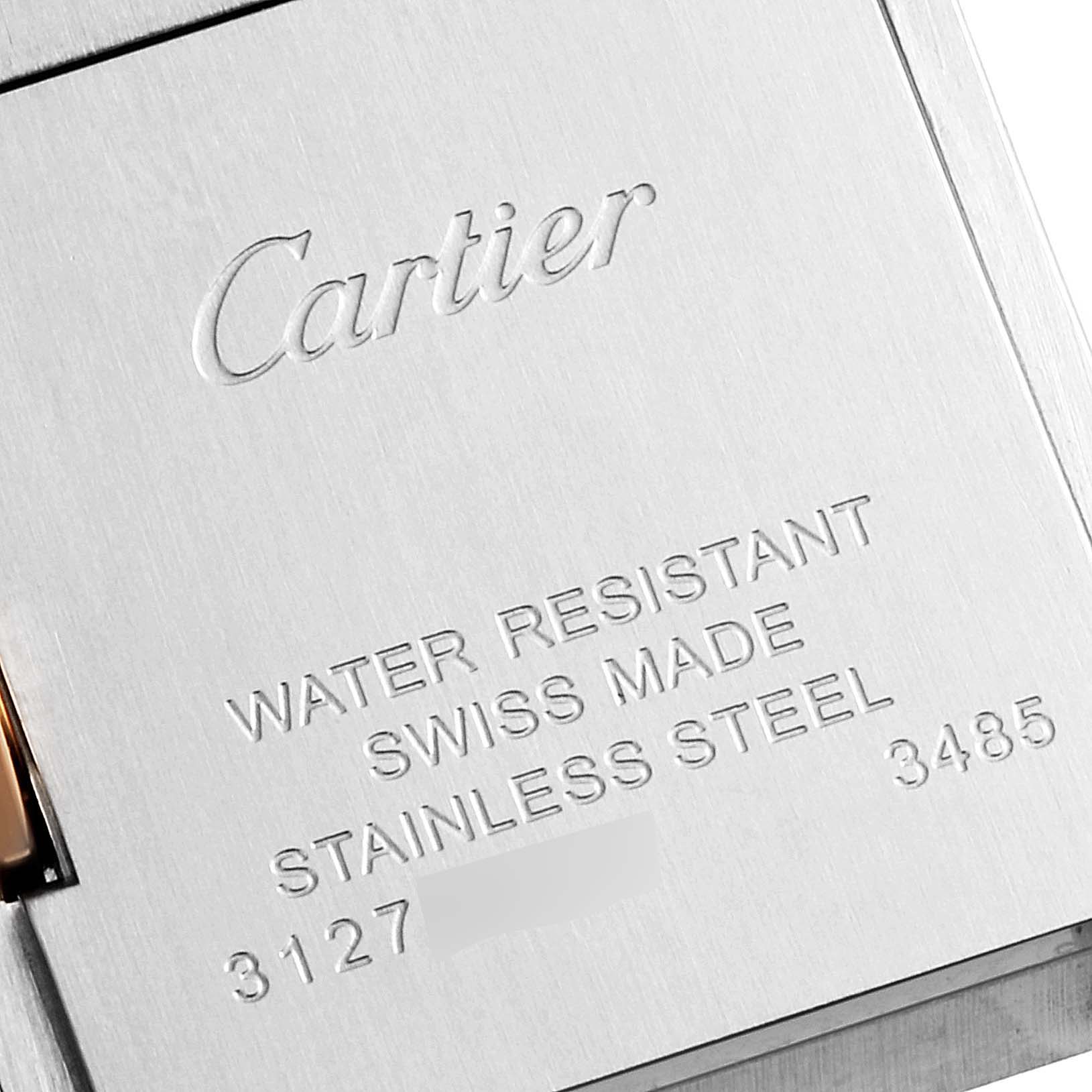 The image shows the back of a Cartier Tank Anglaise W5310019 Women's Steel and Gold (two tone) Silver Dial W5310019 Women's Steel and Gold (two tone) Silver Dial watch, displaying brand engraving and specifications.