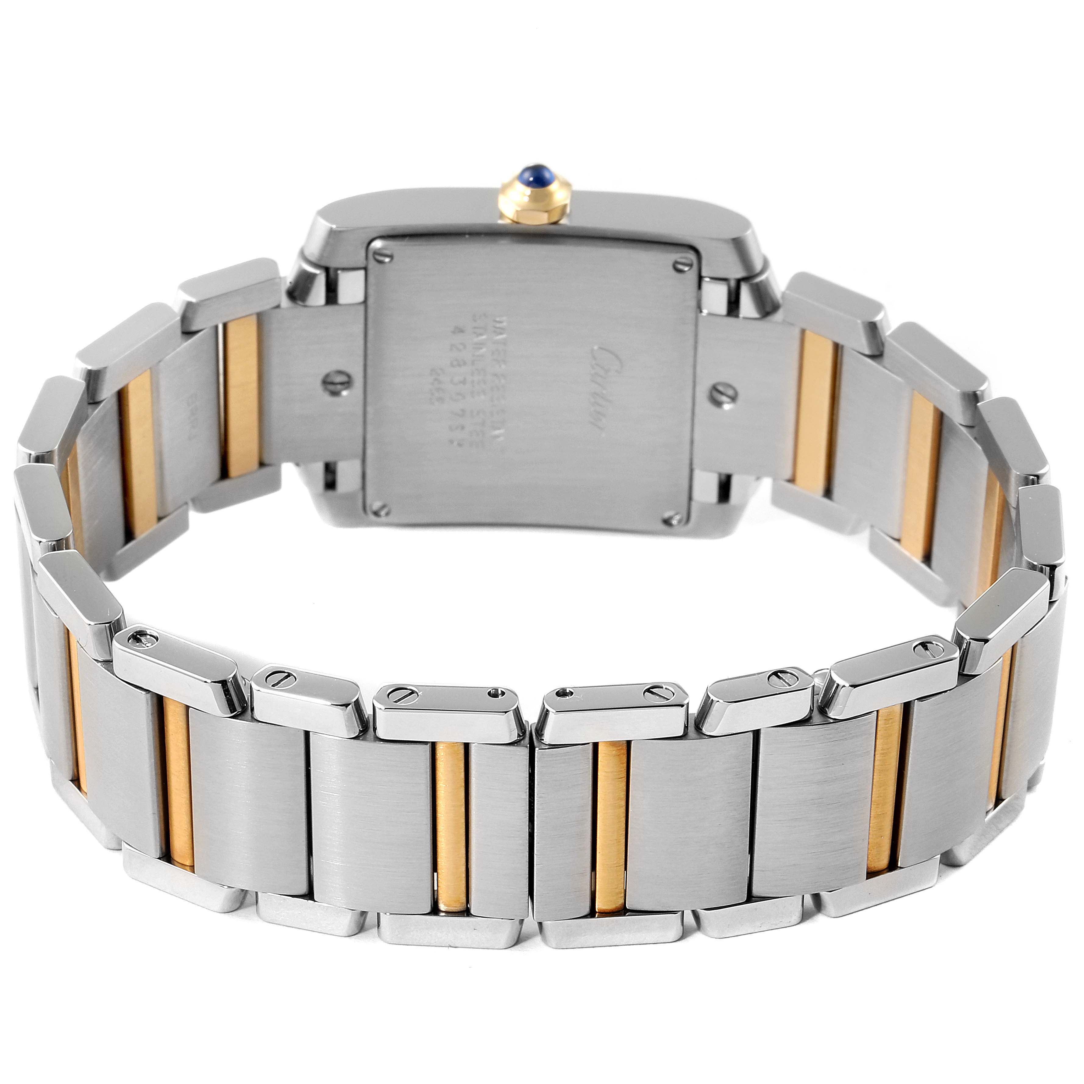 The image shows the back and bracelet of a Cartier Tank Française watch, highlighting the stainless steel and gold accents.
