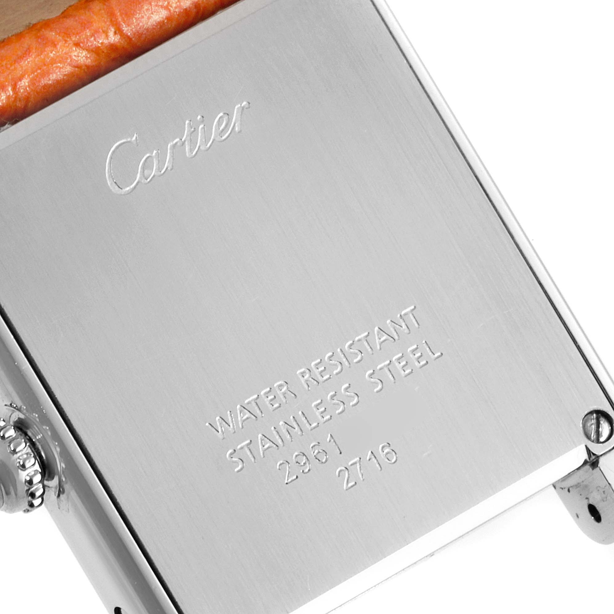The image shows the back case of the Cartier Tank Solo W1019455 Women's Stainless Steel Orange Dial W1019455 Women's Stainless Steel Orange Dial watch, displaying the brand name and material details.