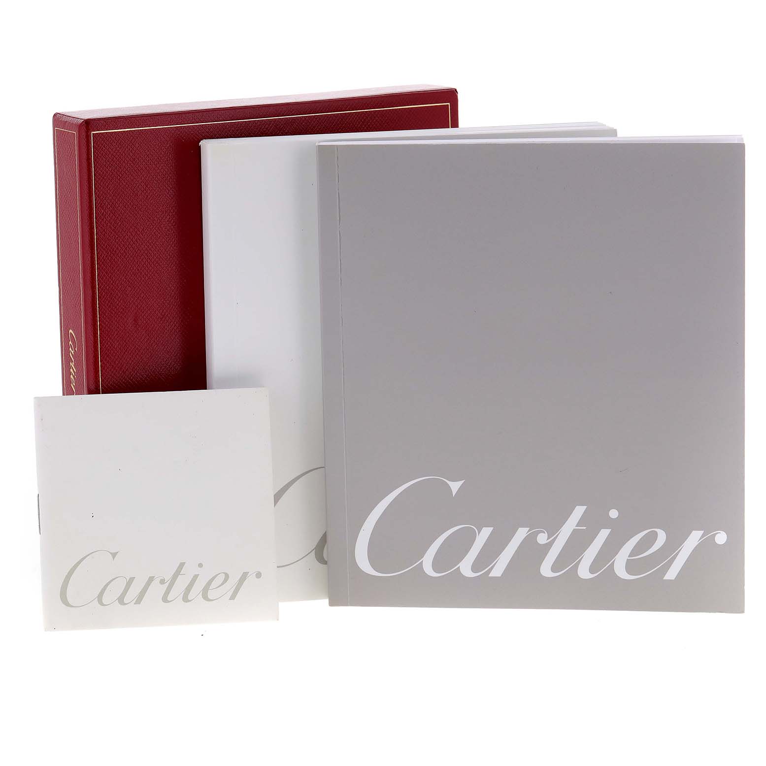 The image shows the packaging, warranty card, and booklets for the Cartier Tank Solo W1019455 Women's Stainless Steel Orange Dial W1019455 Women's Stainless Steel Orange Dial watch.