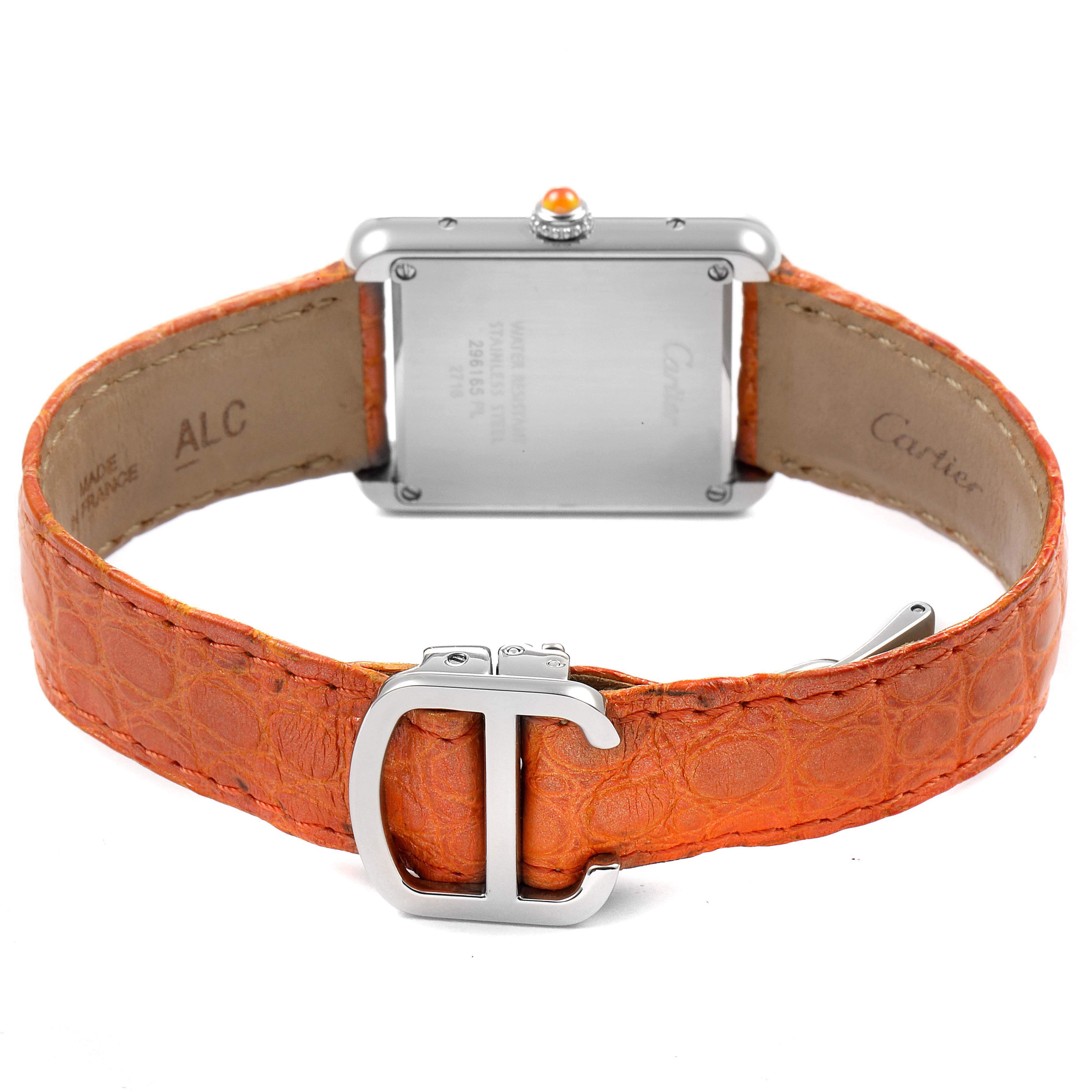The image shows the back view of a Cartier Tank Solo W1019455 Women's Stainless Steel Orange Dial W1019455 Women's Stainless Steel Orange Dial watch with an orange leather strap and deployment buckle.
