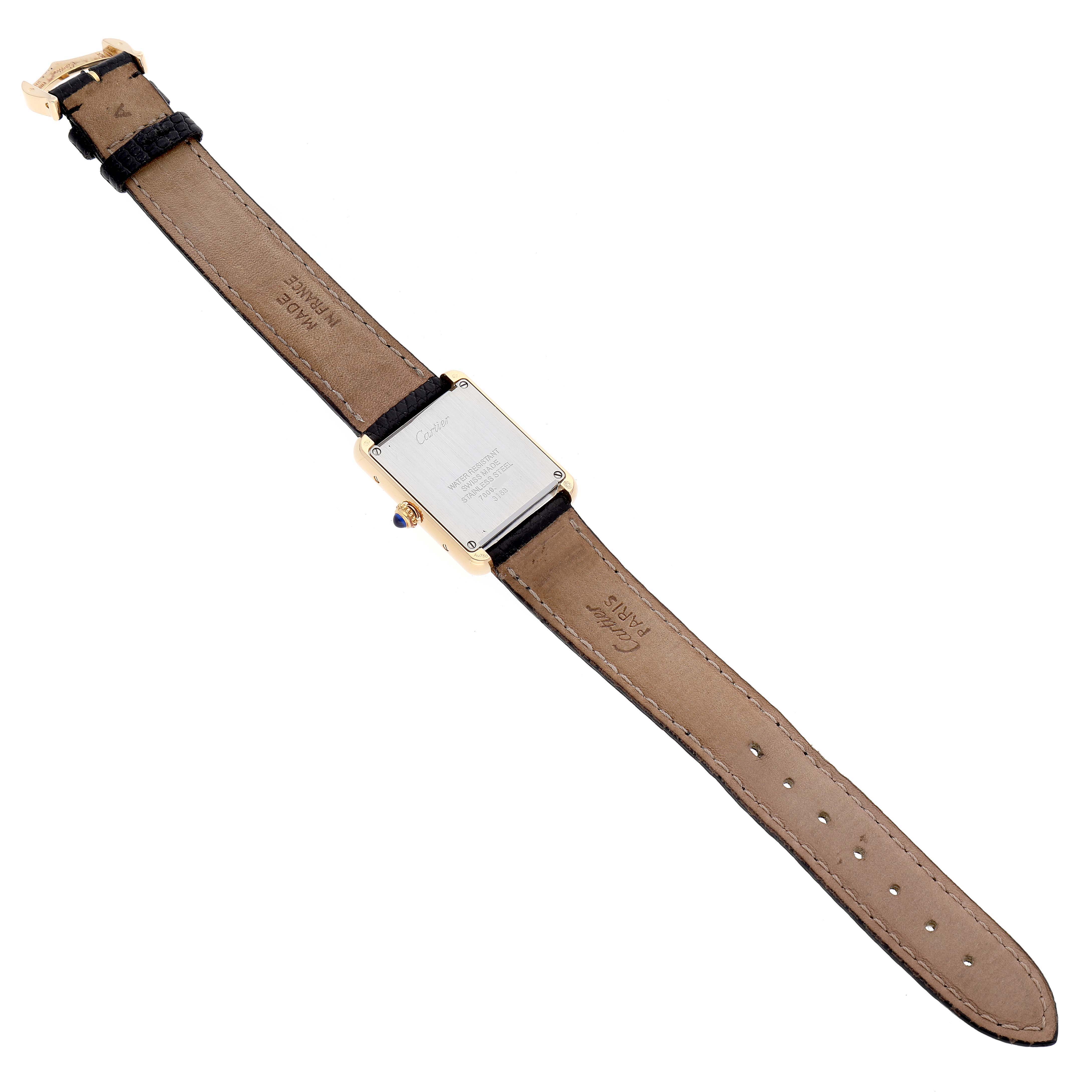 The image shows the back view of a Cartier Tank Solo W5200002 Men
s Yellow Gold Silver Dial W5200002 Men
s Yellow Gold Silver Dial watch, highlighting the case back and leather strap.