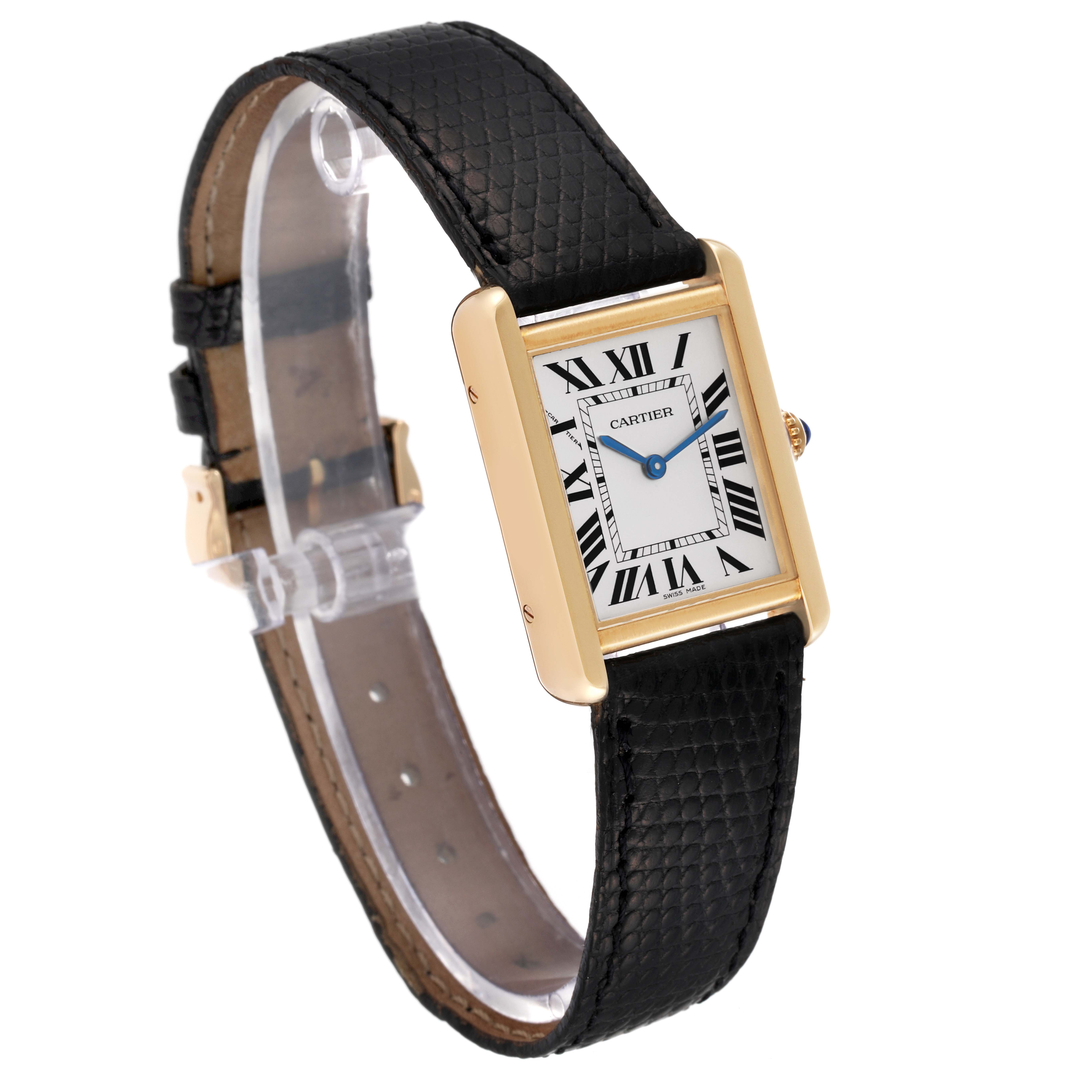 This image shows a Cartier Tank Solo W5200002 Men
s Yellow Gold Silver Dial W5200002 Men
s Yellow Gold Silver Dial watch from a side angle, displaying its face, bezel, crown, and leather strap.