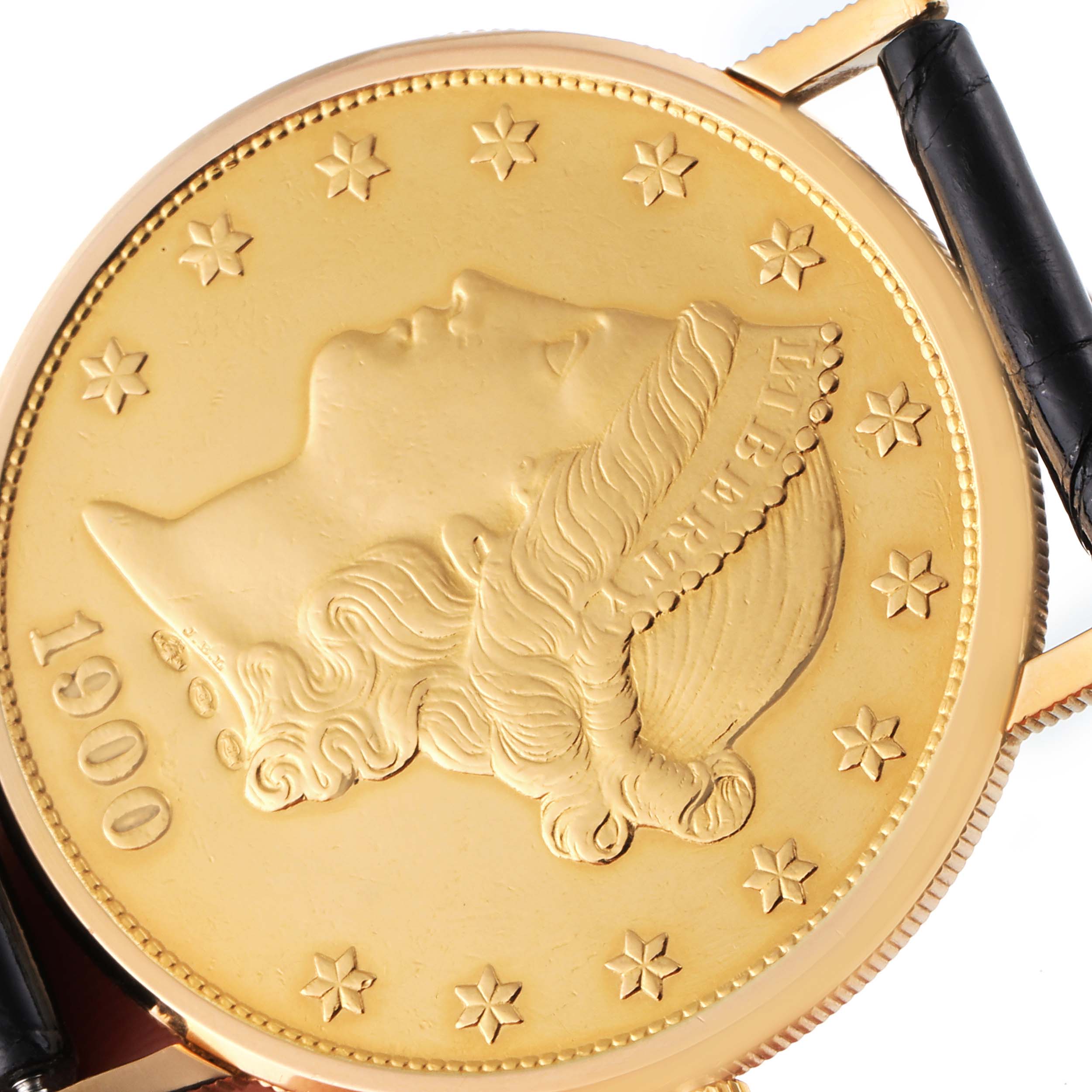 The image shows a close-up, top view of the dial of a Corum Coin Watch 1900 Men's Yellow Gold Black Dial 1900 Men's Yellow Gold Black Dial model, highlighting the coin design and strap attachment.