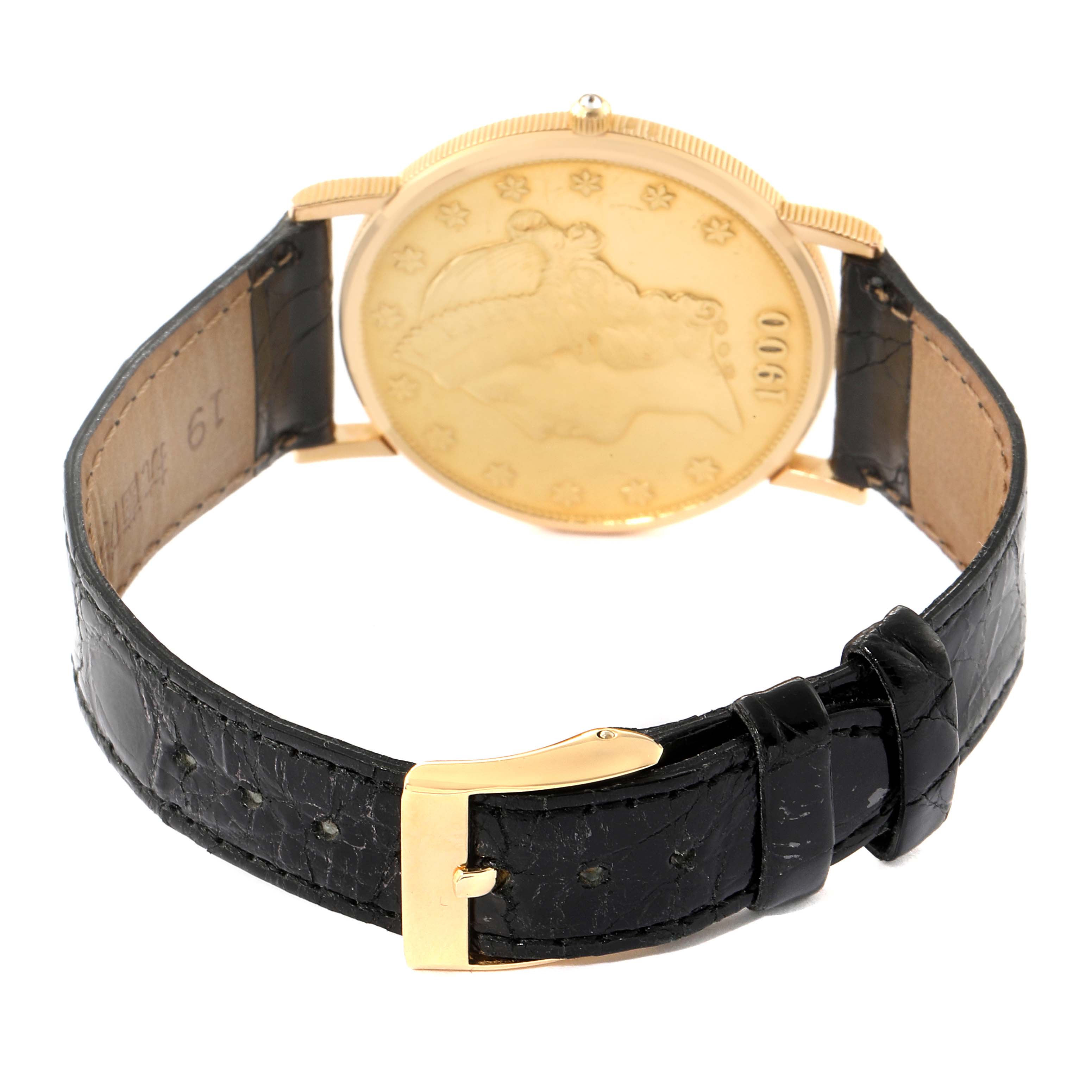 The image shows the back and strap of a Corum Coin Watch 1900 Men's Yellow Gold Black Dial 1900 Men's Yellow Gold Black Dial, highlighting its gold coin case and black leather band.