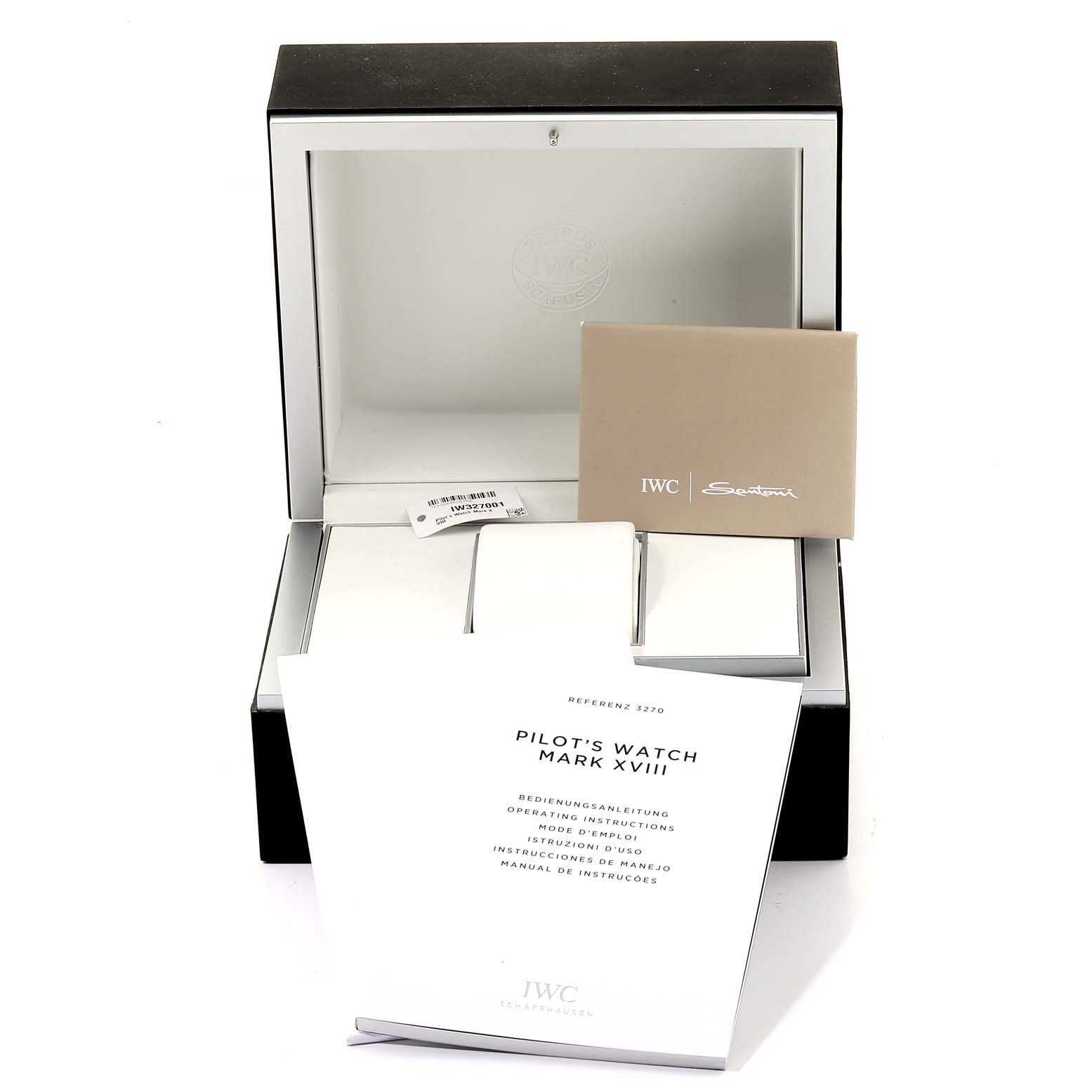 The image shows the open packaging of an IWC Pilot IW327001 Men's Stainless Steel Black Dial IW327001 Men's Stainless Steel Black Dial's Watch Mark XVIII, along with its manual and information booklet.