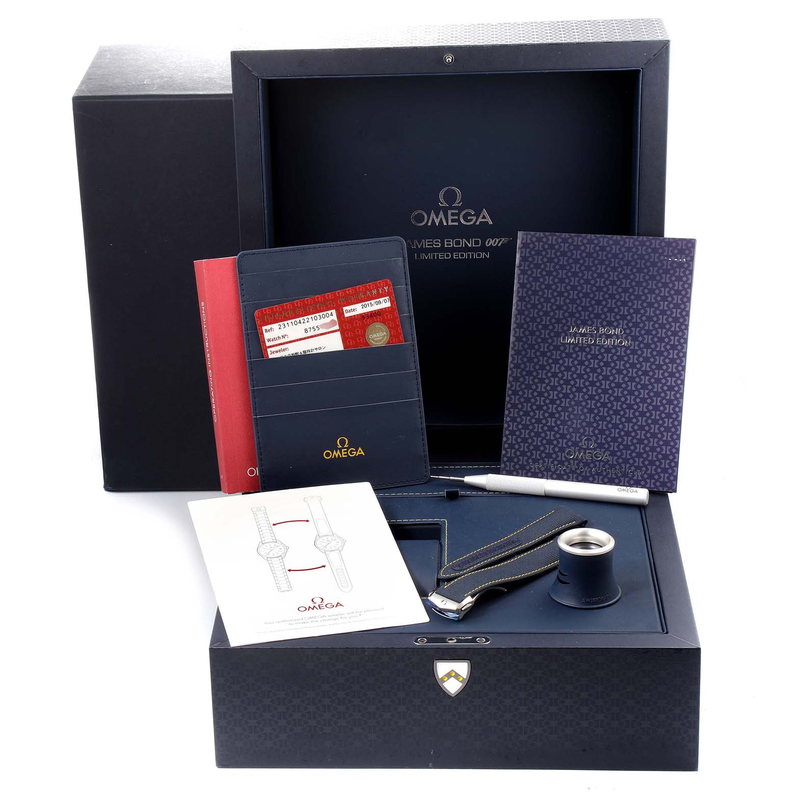 The image shows the packaging of an Omega Aqua Terra 231.10.42.21.03.004 Men's Stainless Steel Blue Dial 231.10.42.21.03.004 Men's Stainless Steel Blue Dial James Bond Limited Edition watch, including booklets, cards, strap, and a magnifying tool.