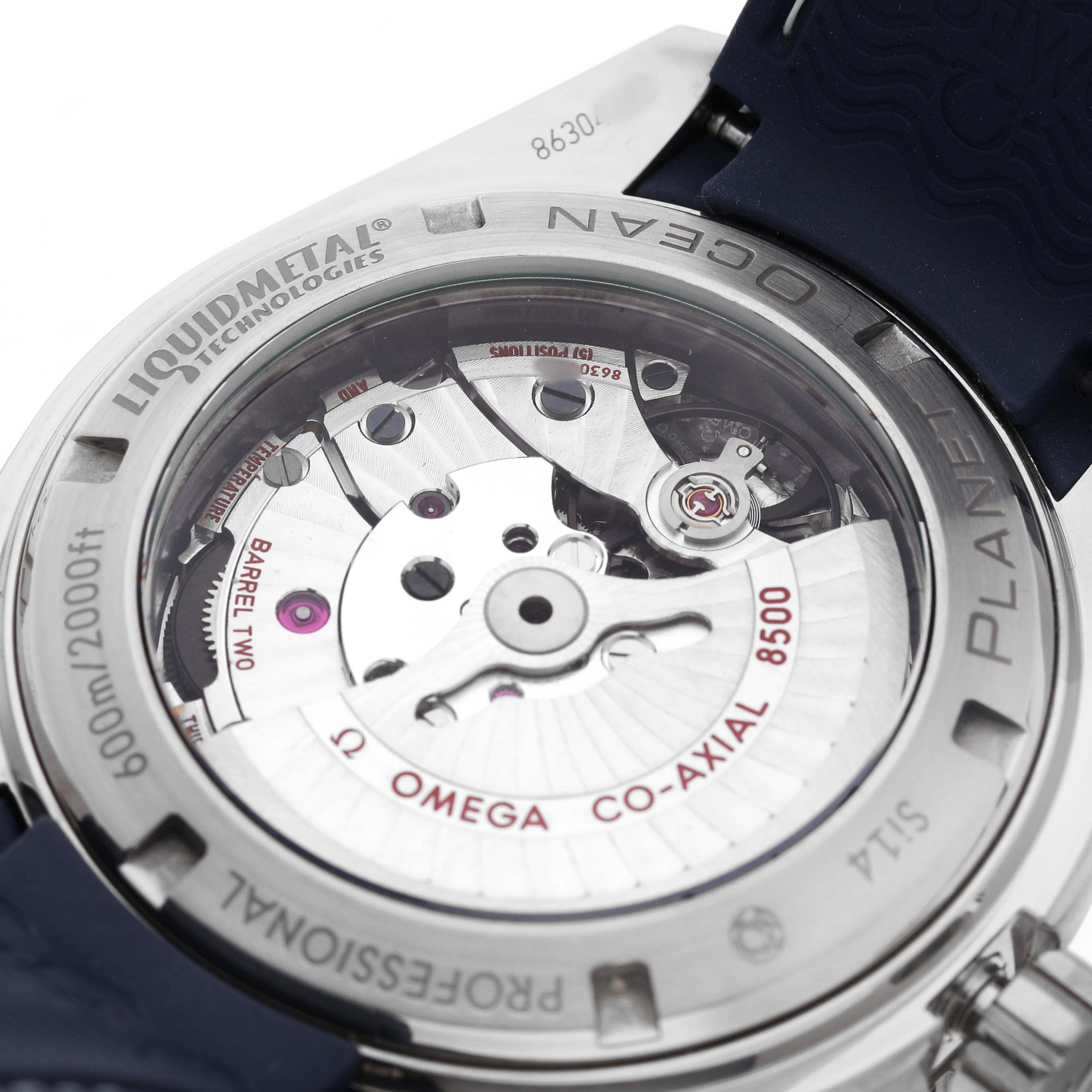 The image shows the back view of an Omega Seamaster 232.92.46.21.03.001 Men's Titanium Blue Dial, highlighting its exposed movement and casing details.