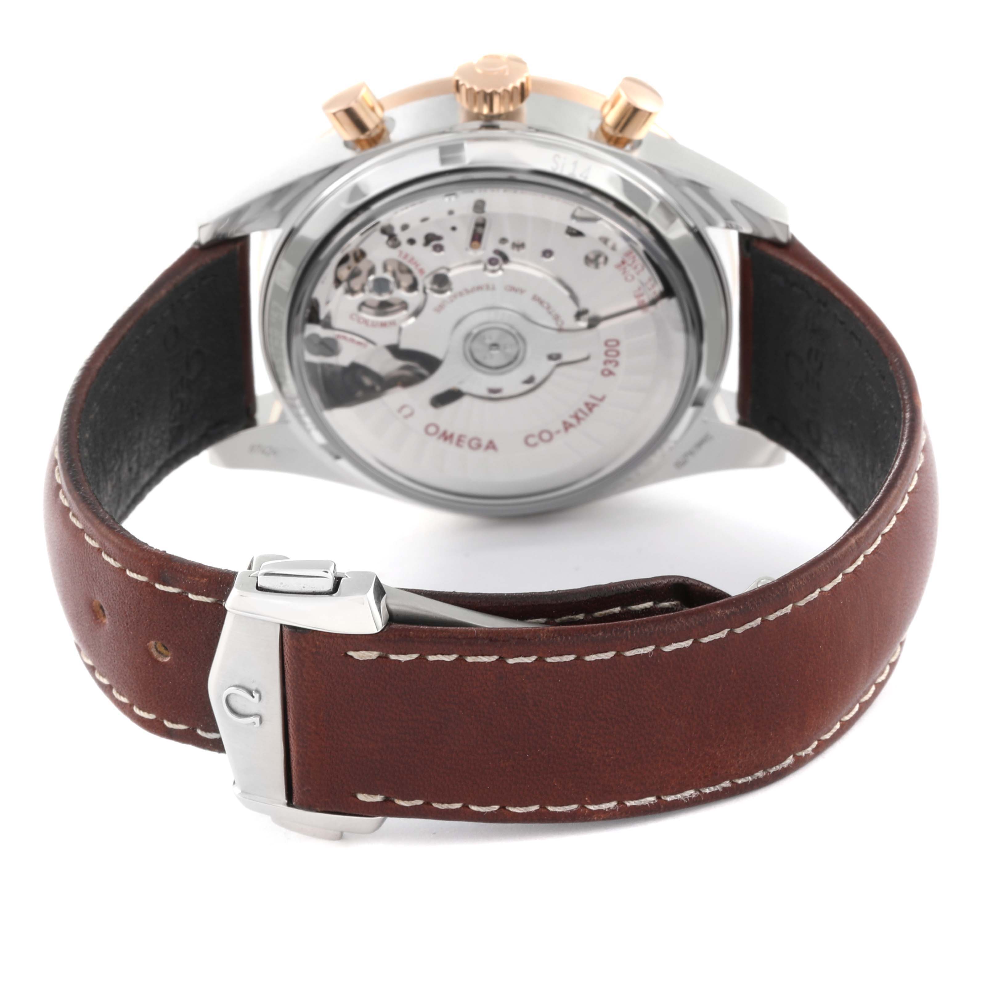 The image shows the back view of the Omega Speedmaster 331.22.42.51.01.001 Men's Stainless Steel Black Dial 331.22.42.51.01.001 Men's Stainless Steel Black Dial watch, highlighting the movement through a transparent case back, with a brown leather strap and clasp.